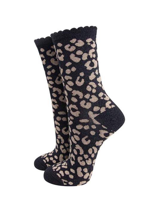 black ankle socks with a gold leopard print pattern, all over glitter sparkle and black scalloped cuff