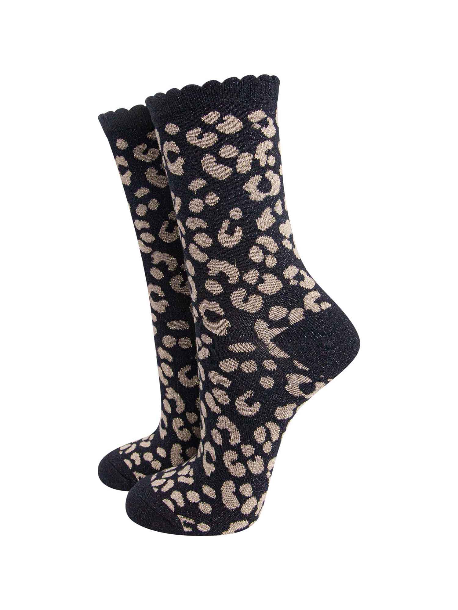 black ankle socks with a gold leopard print pattern, all over glitter sparkle and black scalloped cuff