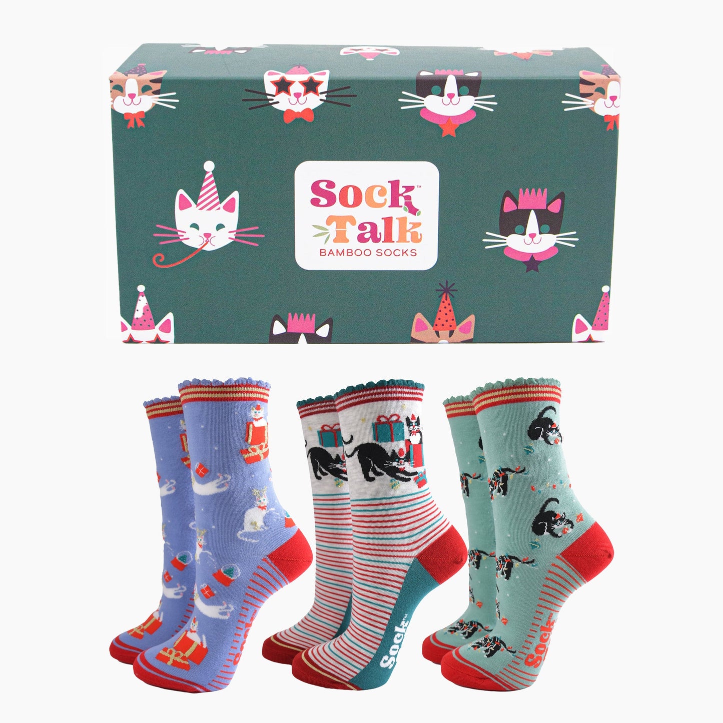 a green gift box adorned with cats wearing party hats and three pairs of festive inspired cat socks