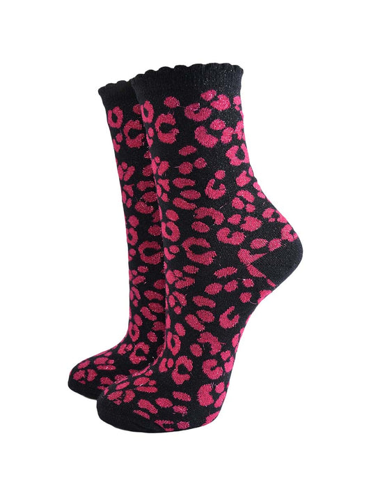pink ankle socks with a black leopard print pattern, all over glitter sparkle and black scalloped cuff