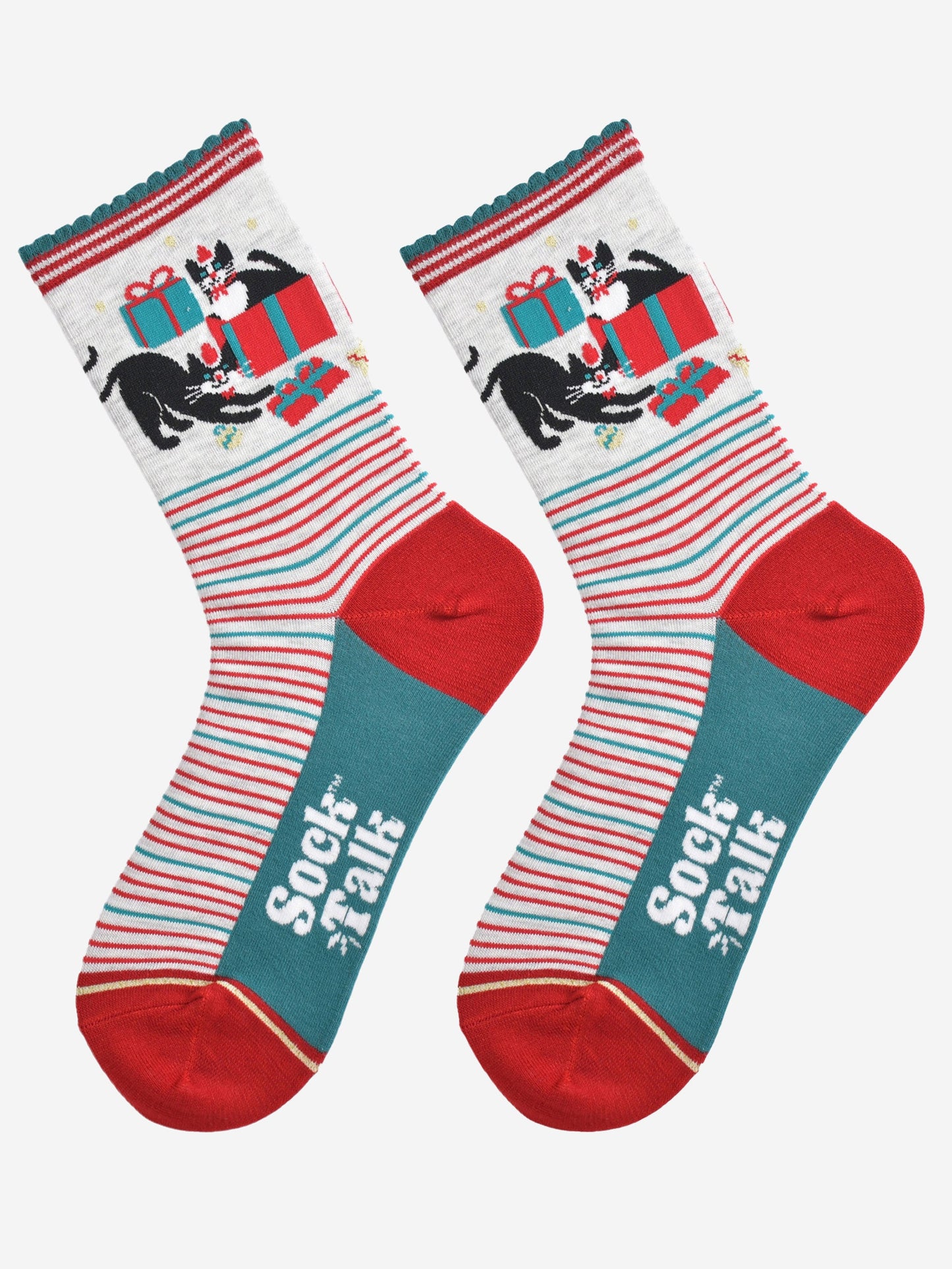 showing the socks laying flat, the black and white cats playing with christmas presents are prominent on the ankles and contrast the green and red striped patten on the feet of the socks