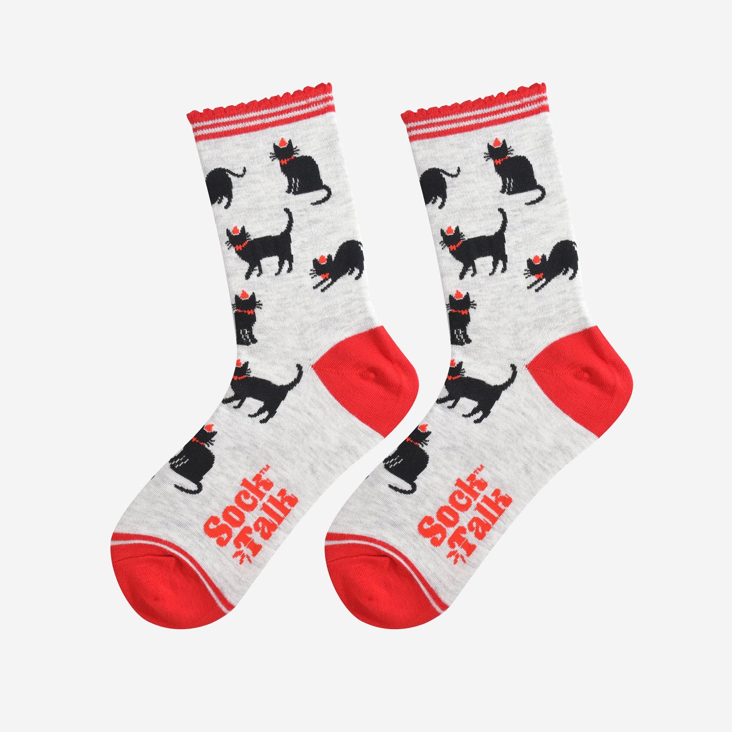 showing the black cat socks laying flat, highlighting the all over pattern of sitting, strutting and stretching cats, each wearing a red party hat and bow tie