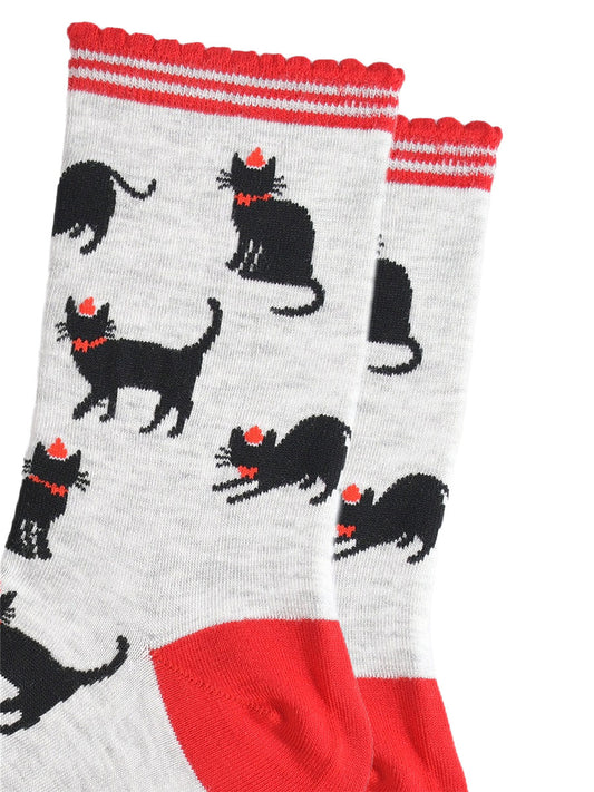 close up of the black cat design, the cats are wearing red party hats and bow ties