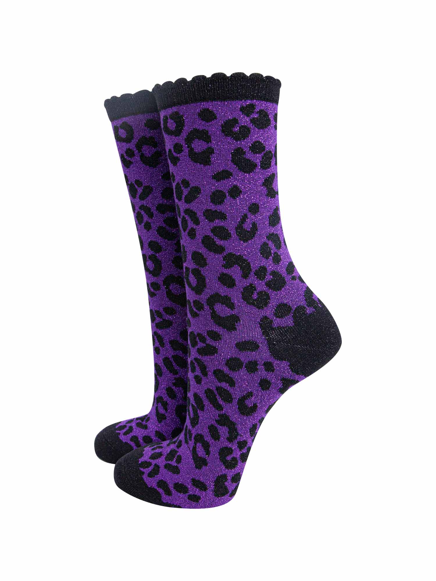 purple ankle socks with a black leopard print pattern, all over glitter sparkle and black scalloped cuff
