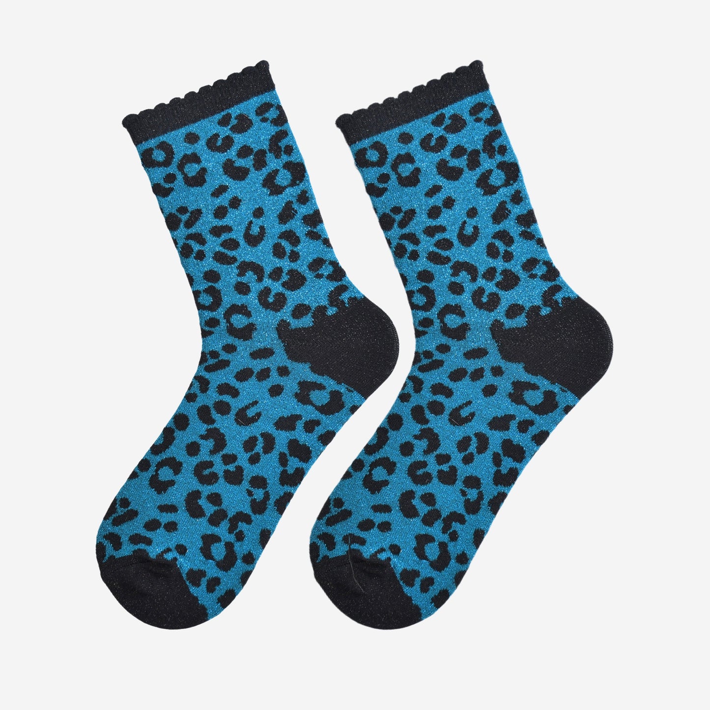 showing the teal and black leopard print ankle socks laying flat, the all over silver sparkle is visible