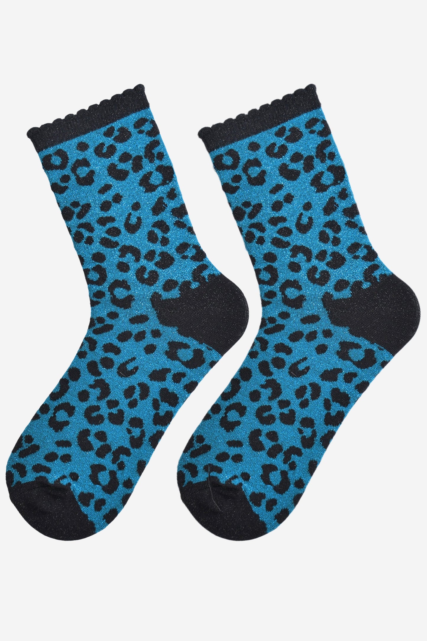 showing the teal and black leopard print ankle socks laying flat, the all over silver sparkle is visible