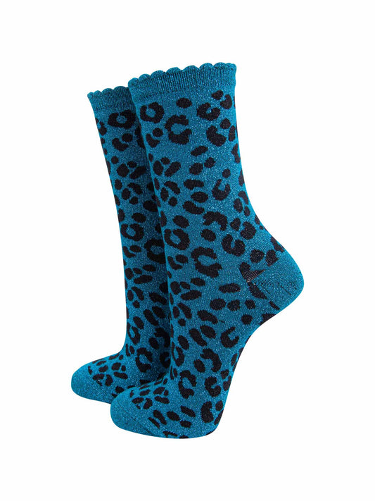 teal ankle socks with a black leopard print pattern, all over glitter sparkle and black scalloped cuff