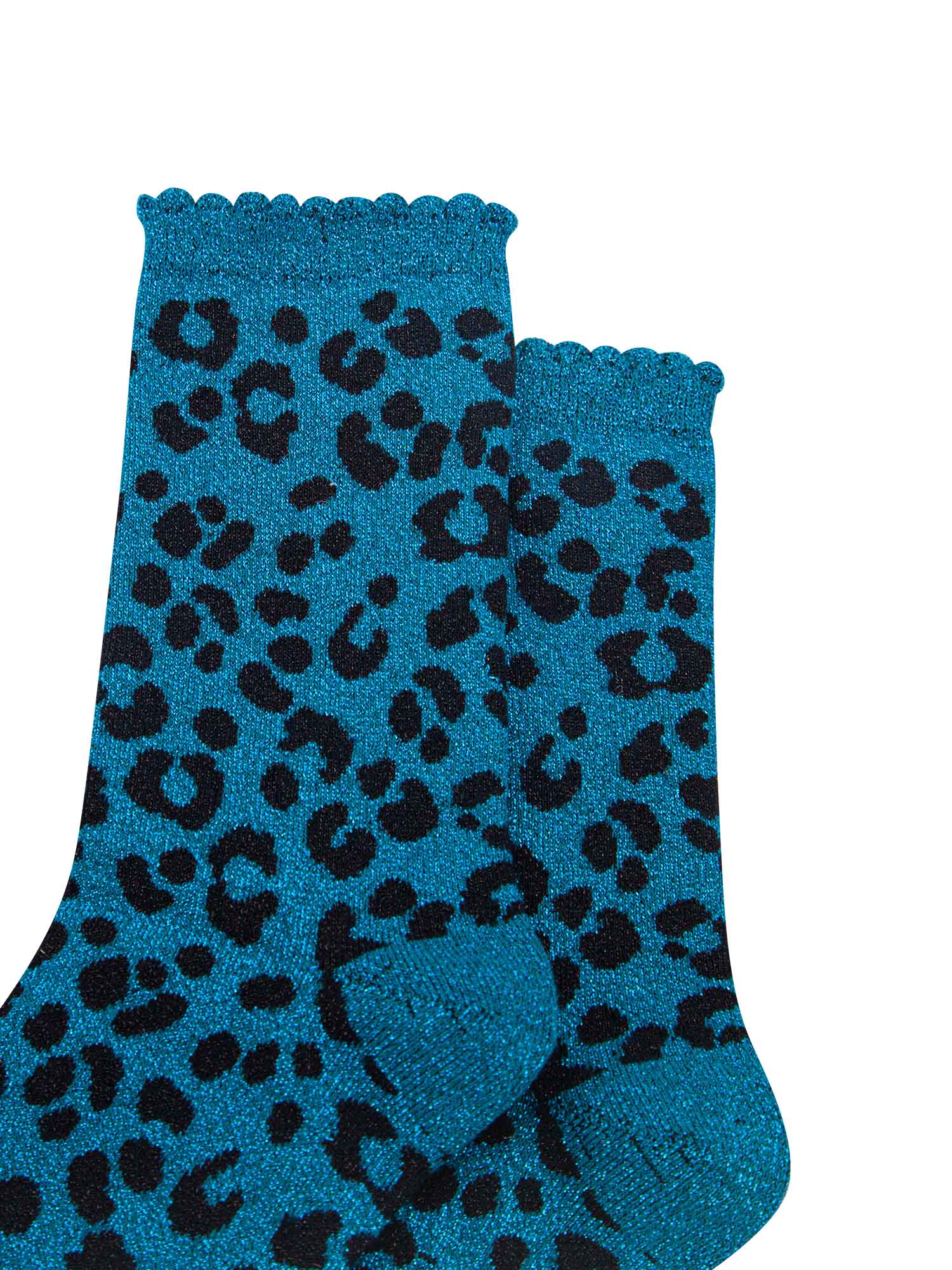 close up of the teal leopard print pattern on the socks, there is a visible silver glitter sparkle all over the design. the teal blue print contrasts with the black base of the socks