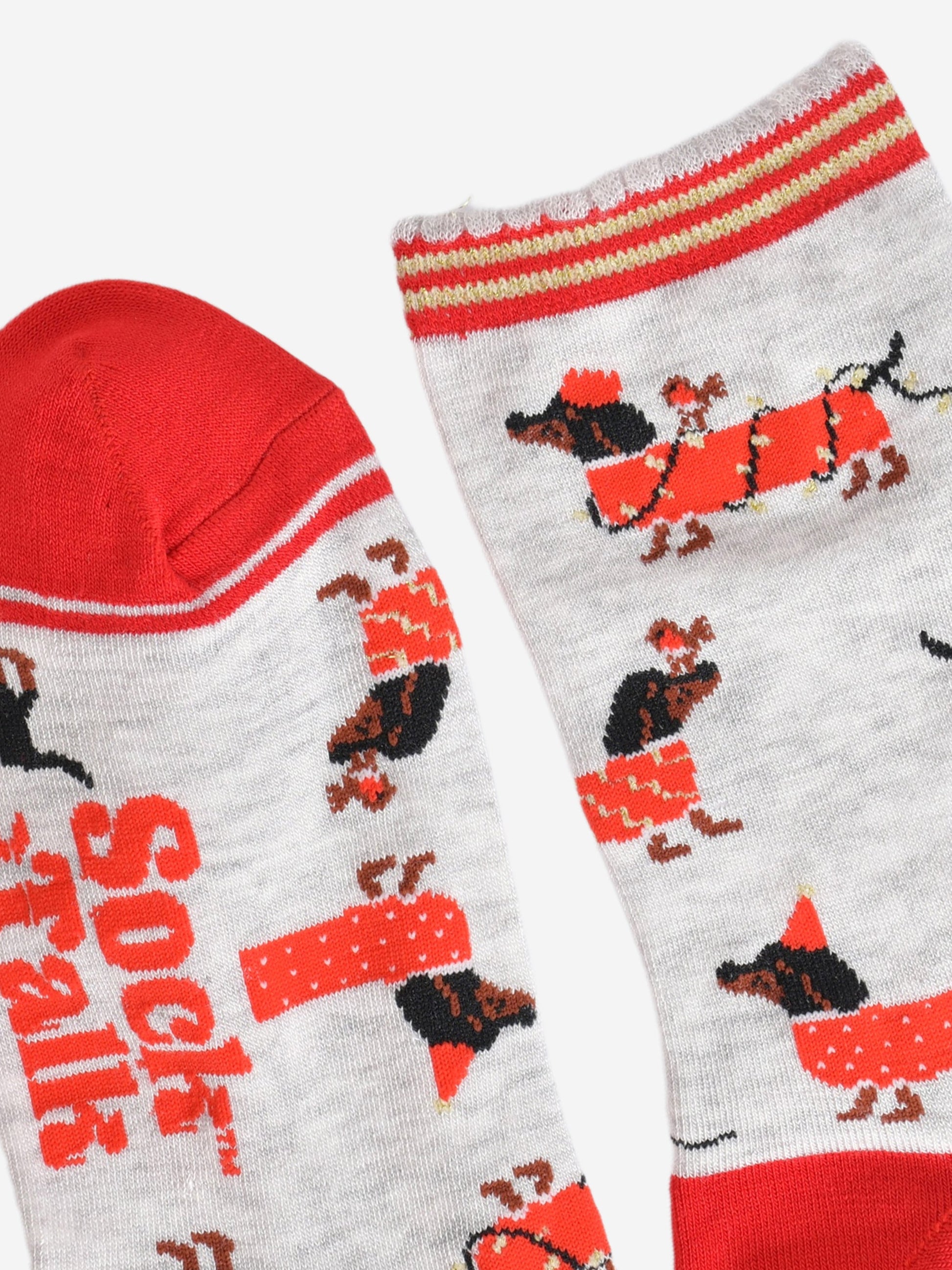 close up of the toe and cuff, the toe is red with a grey border stripe, the cuff is scalloped and has red and gold stripes