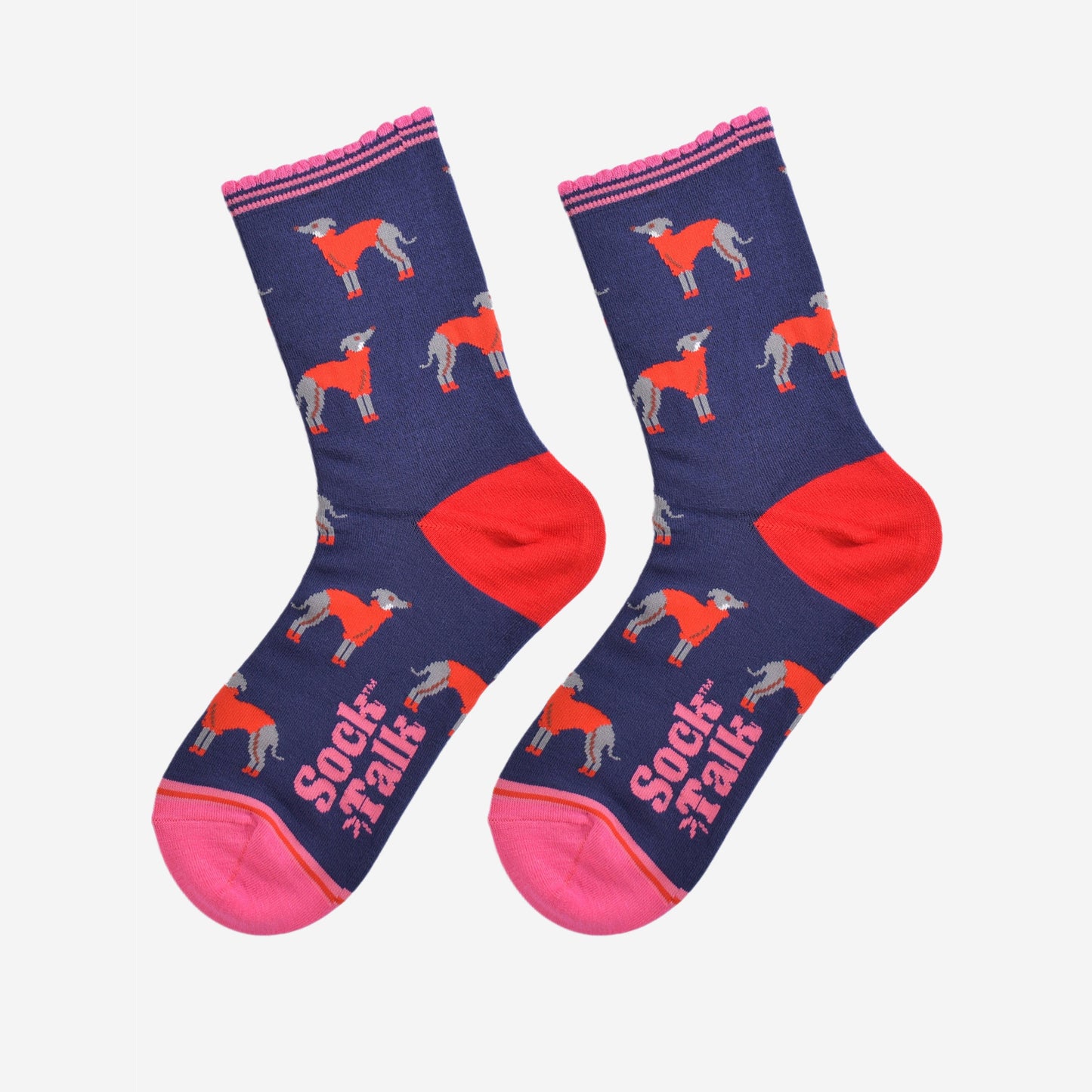 showing the greyhound socks laying flat, the heel is red and the toe and cuff are pink in contrast to the navy blue background of the socks. the greyhound dog pattern is all over the body of the socks