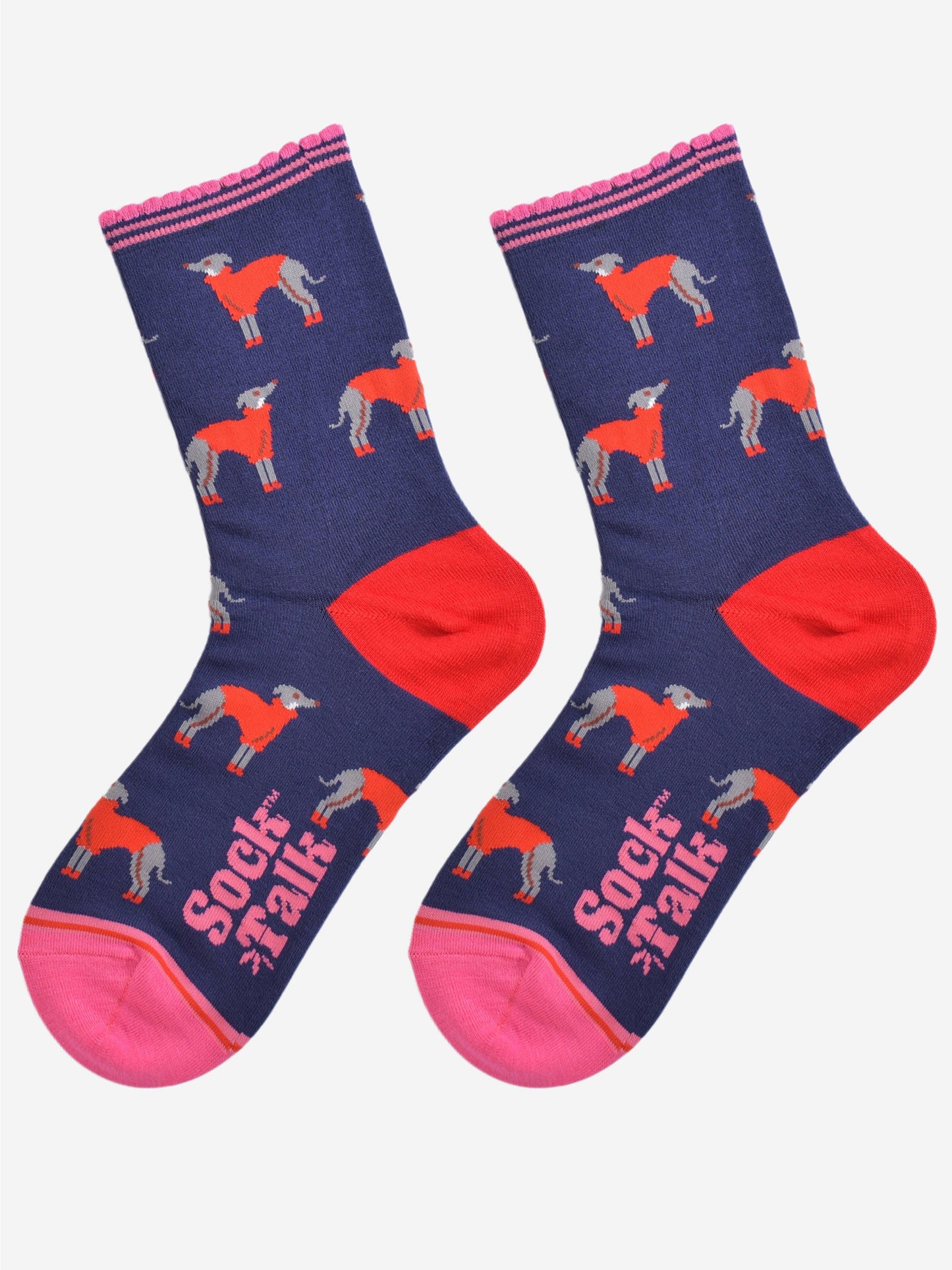 showing the greyhound socks laying flat, the heel is red and the toe and cuff are pink in contrast to the navy blue background of the socks. the greyhound dog pattern is all over the body of the socks