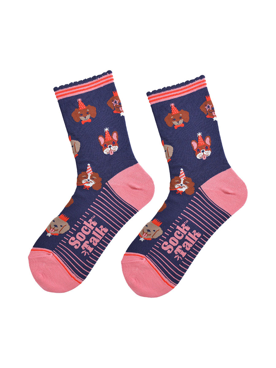 navy blue and pink ankle socks with a pattern of dogs wearing party hats and novelty glasses