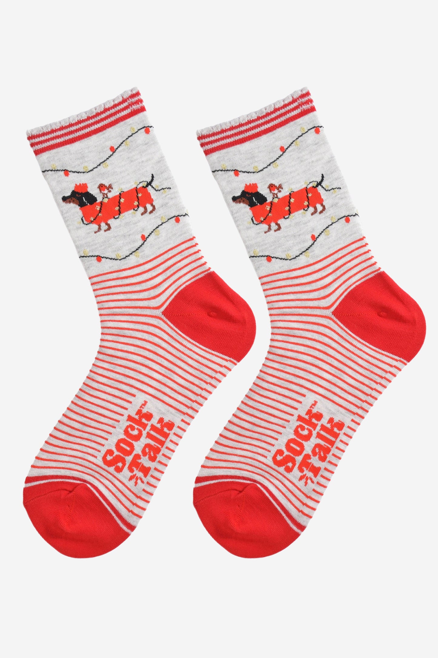 showing the socks laying flat, there is a red and grey stripe pattern on the body of the socks and the sausage dog design is on the ankles