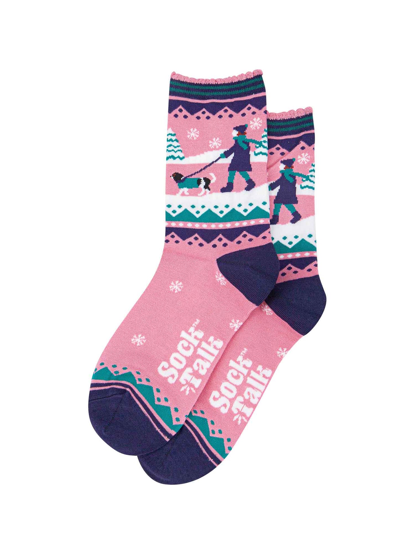 pink ankle socks with blue and green accents, showing a snowy winter scene with a woman walking a king charles spaniel