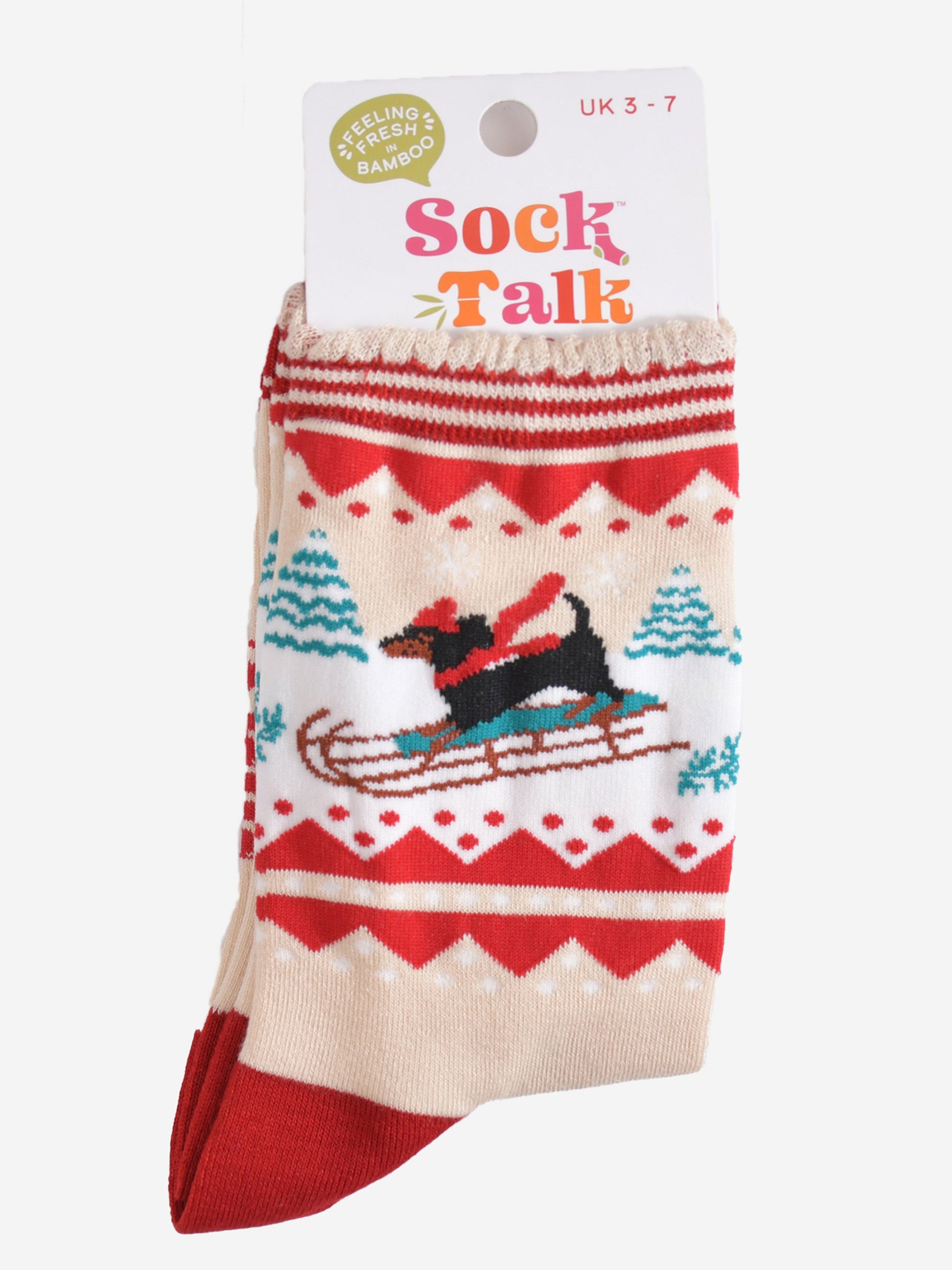 sledging sausage dog bamboo socks in their sock talk packaging, these socks are a uk size 3-7