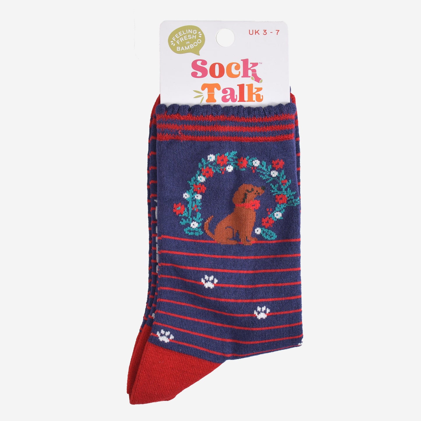 navy sausage dog and wreath bamboo socks in their sock talk packaging, these socks are a uk size 3-7