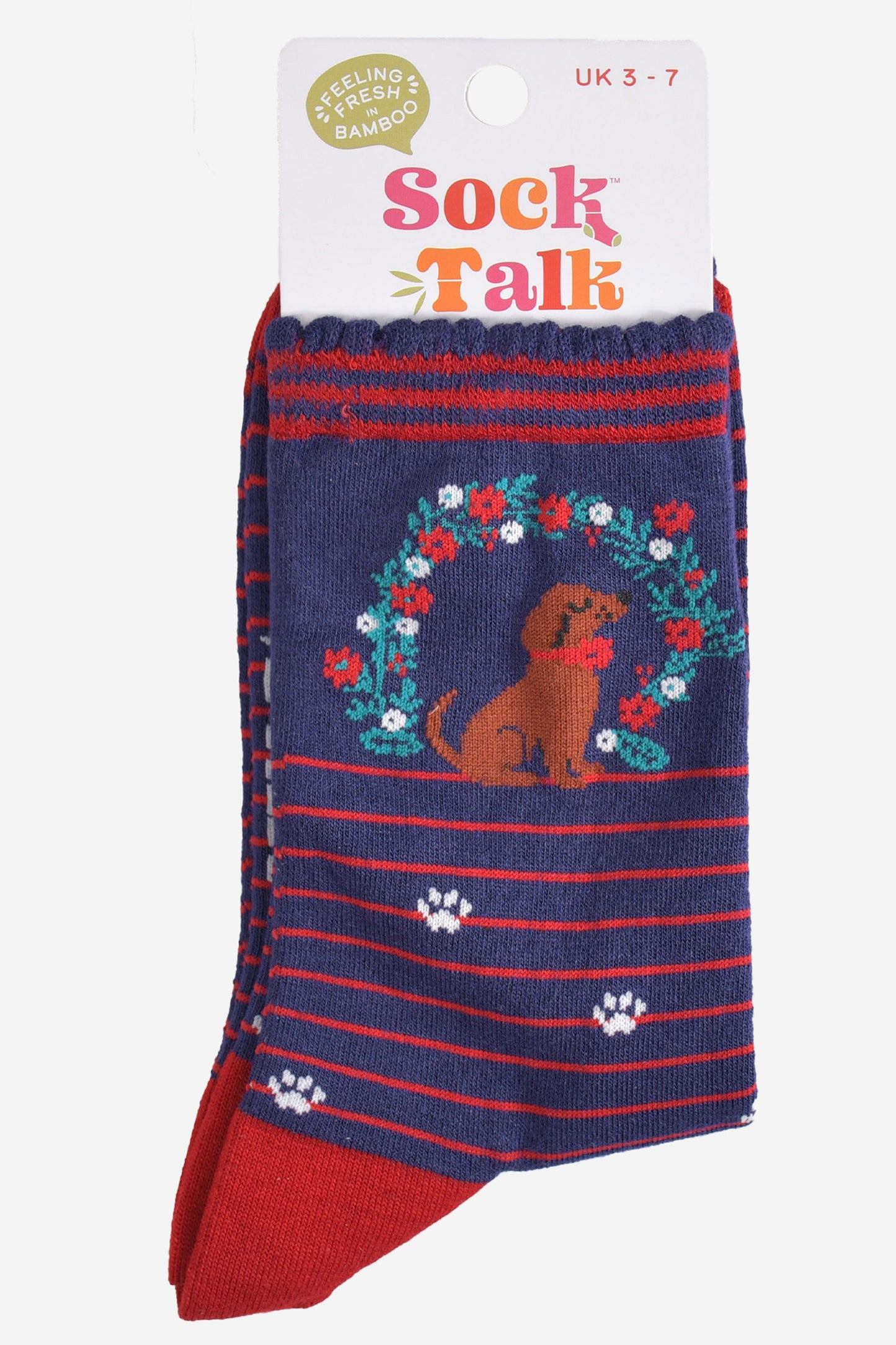 navy sausage dog and wreath bamboo socks in their sock talk packaging, these socks are a uk size 3-7