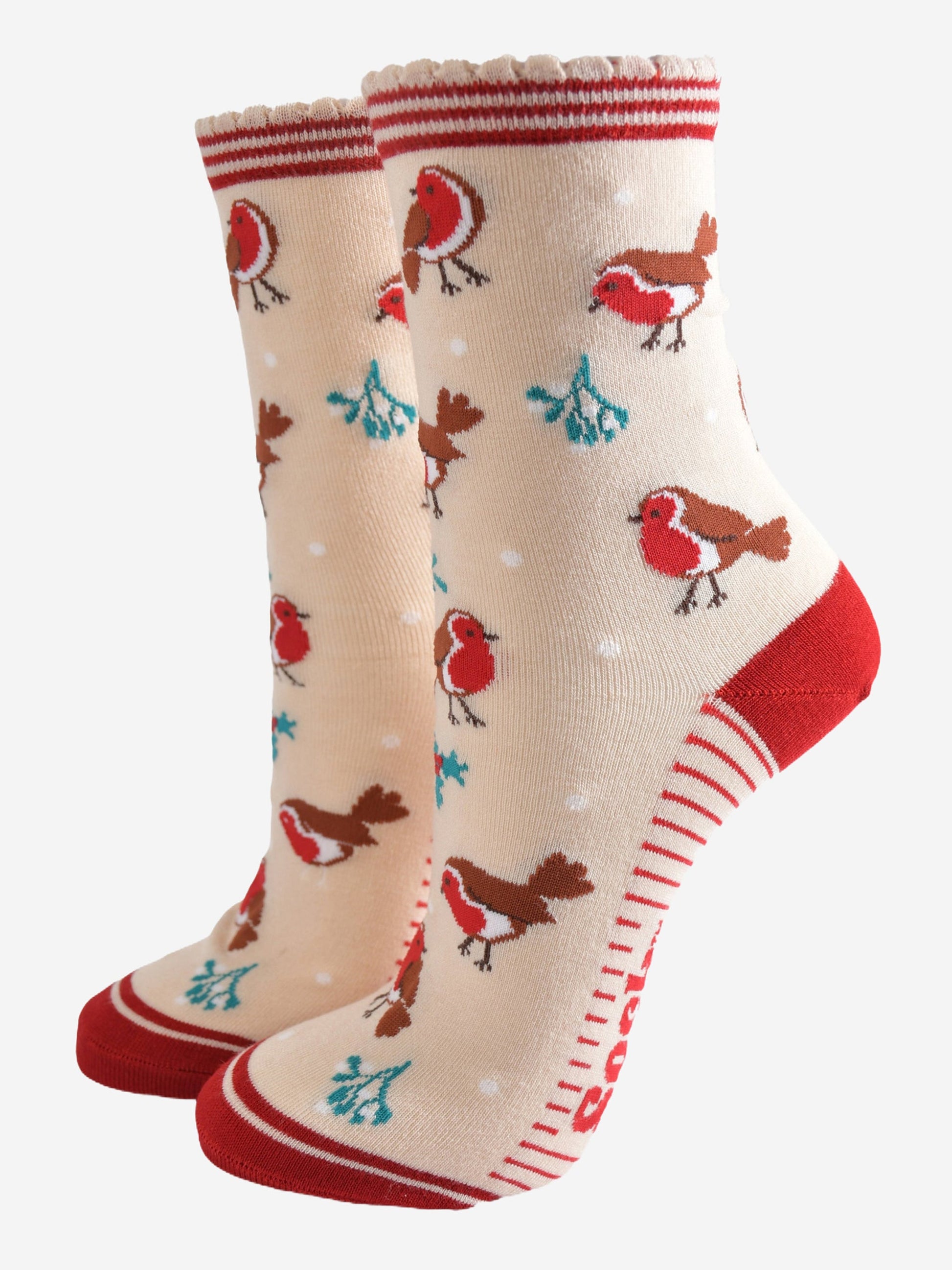 cream socks with a red striped cuff with a pattern of red robin birds, mistletoe and holly all over