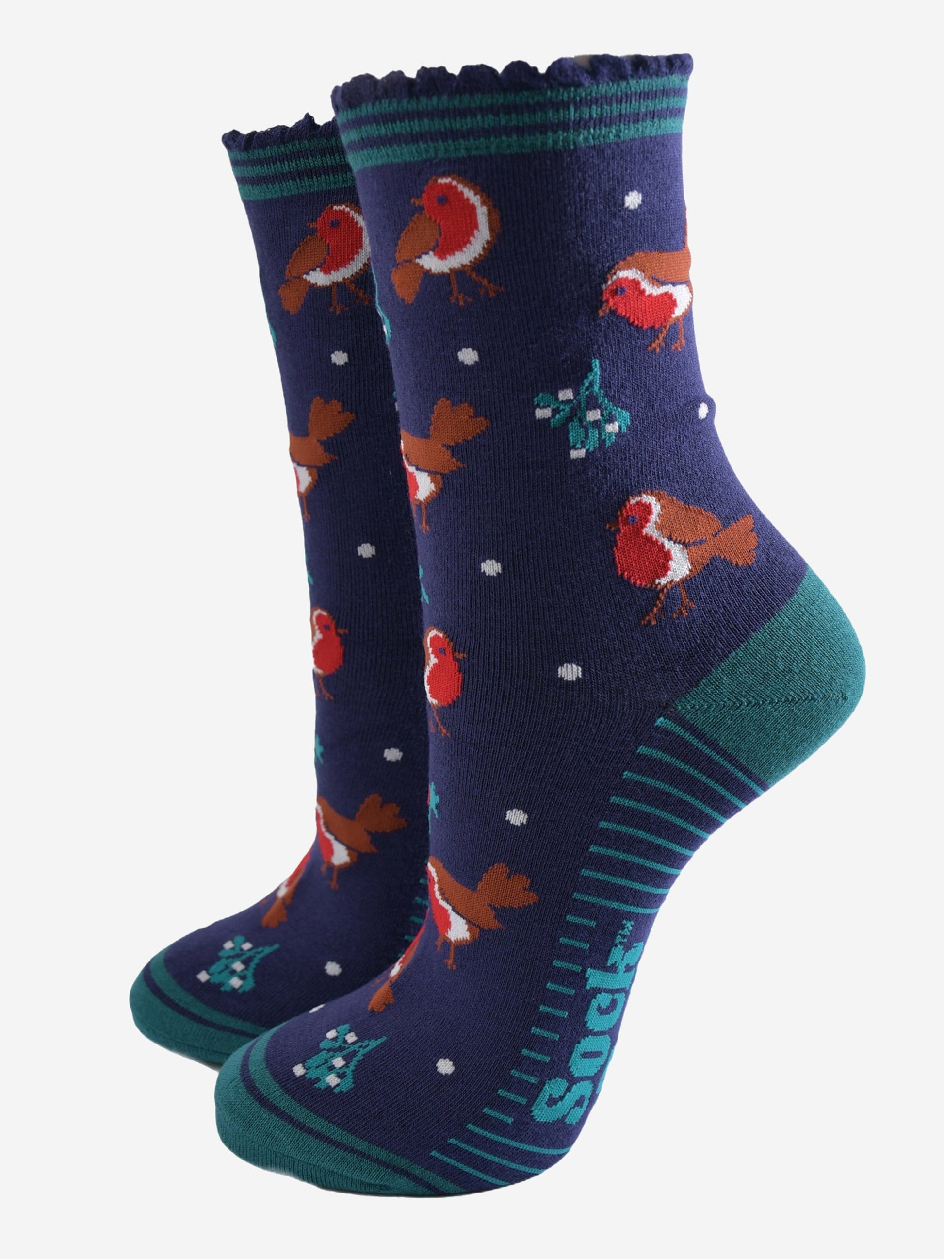 navy blue socks with a green striped cuff with a pattern of red robin birds, mistletoe and holly all over