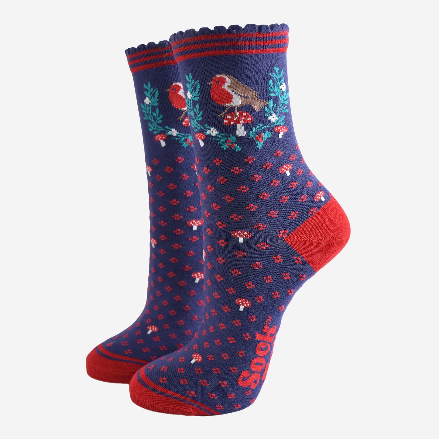 navy blue and red bamboo socks with a garland of festive holly, red robin bird and red toadstools