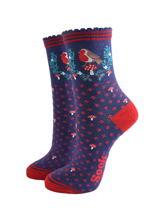 navy blue and red bamboo socks with a garland of festive holly, red robin bird and red toadstools