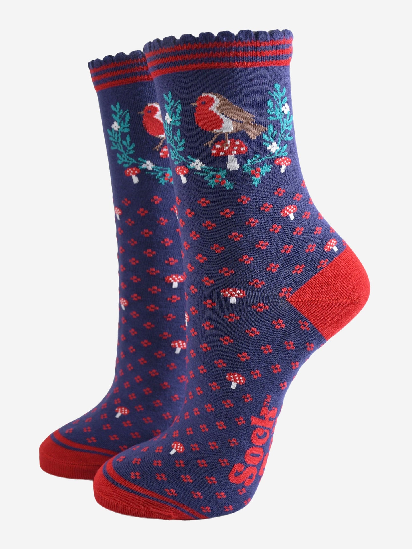 navy blue and red bamboo socks with a garland of festive holly, red robin bird and red toadstools