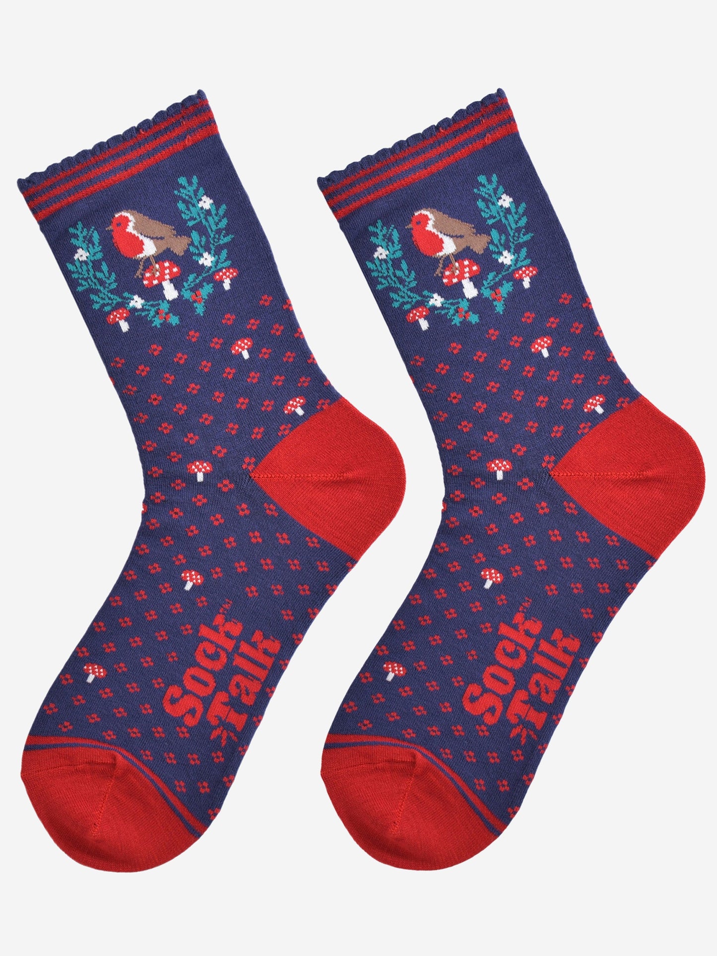 navy blue and red robin christmas socks laying flat, showing the all over floral pattern and the robin and holly motif on the ankle of the socks