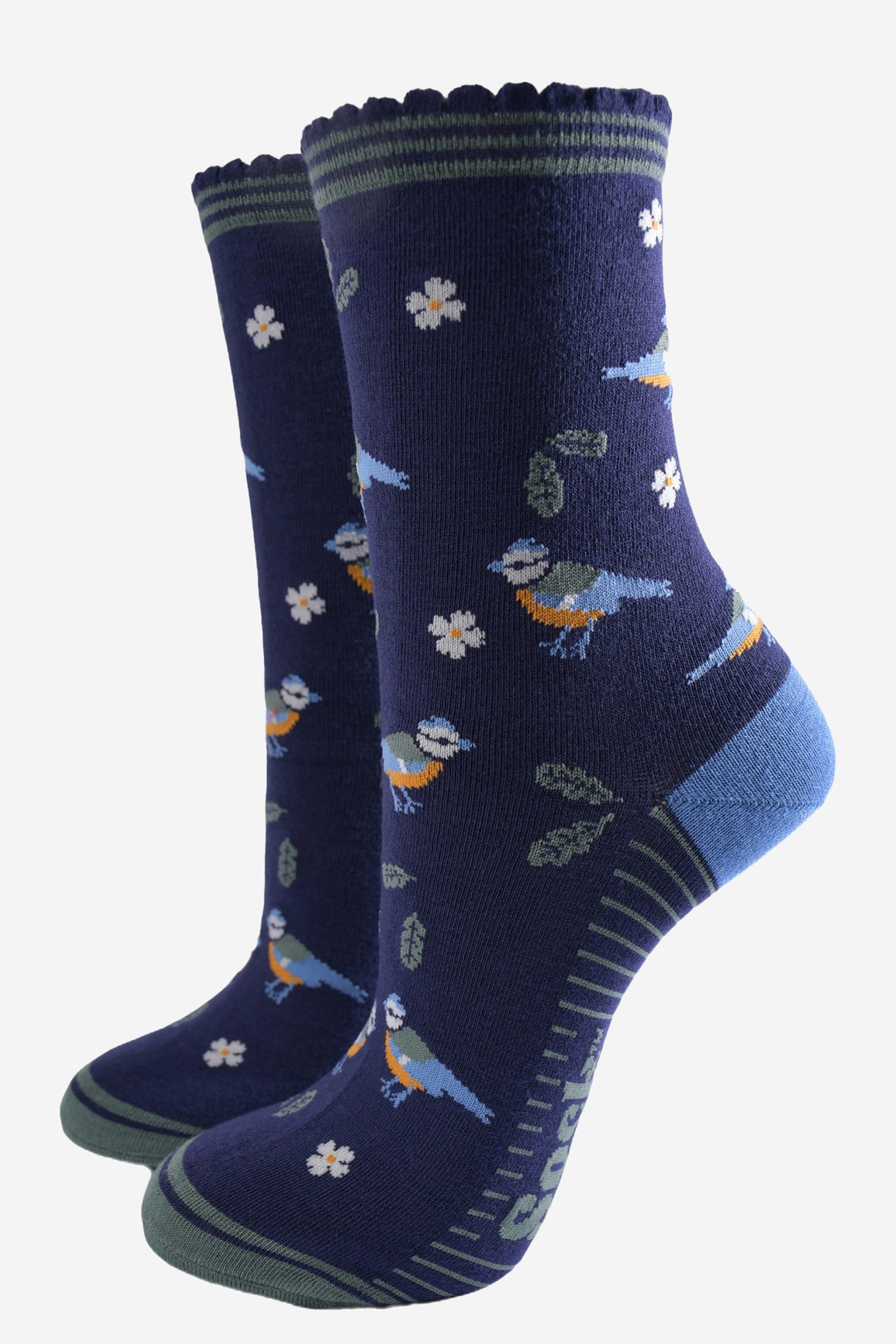 navy blue ankle socks with a pattern of blue tit garden birds, leaves and flowers, the socks have a striped green scalloped cuff