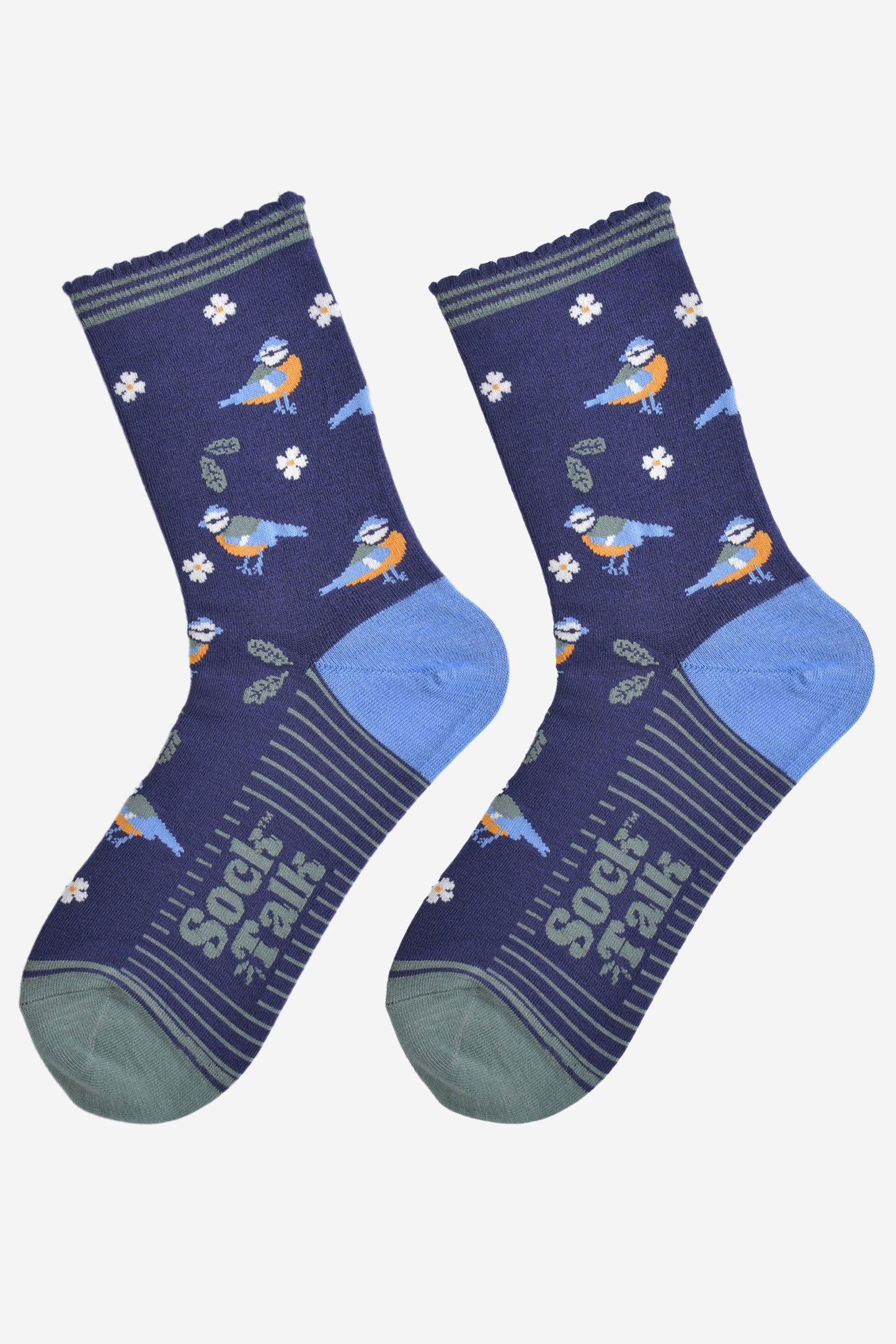 blue tit woodland bamboo socks laying flat, showing the all over pattern of birds, leaves and flowers on a navy blue background