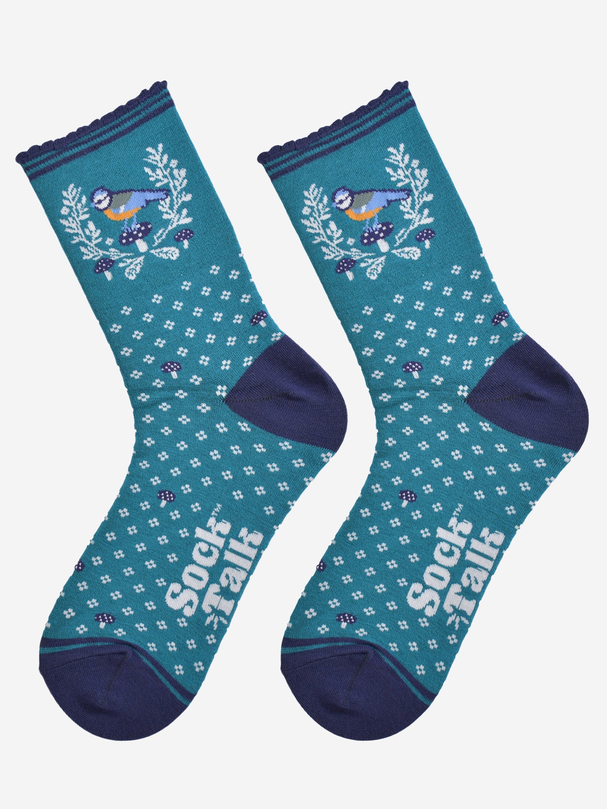 showing the blue tit wreath socks laying flat, detailing the all over floral pattern, wreath and blue tit bird