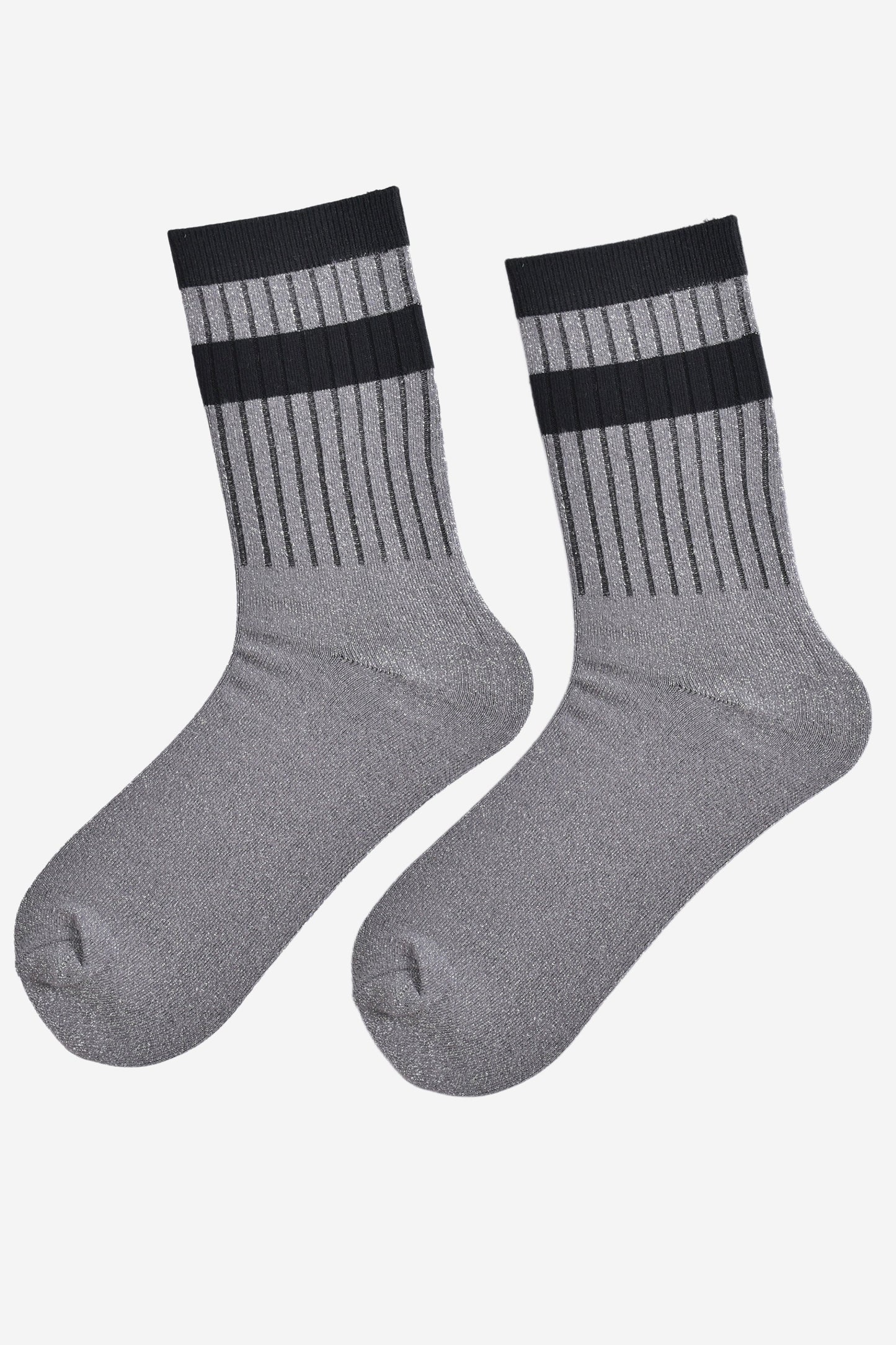 showing the socks laying flat, they have an all over silver glitter sparkle, ribbed cuffs and black striped bands on the cuff and ankle