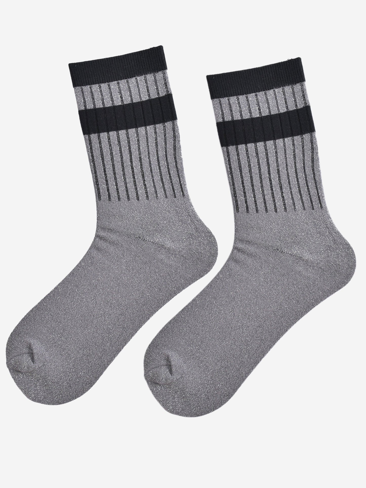 showing the socks laying flat, they have an all over silver glitter sparkle, ribbed cuffs and black striped bands on the cuff and ankle