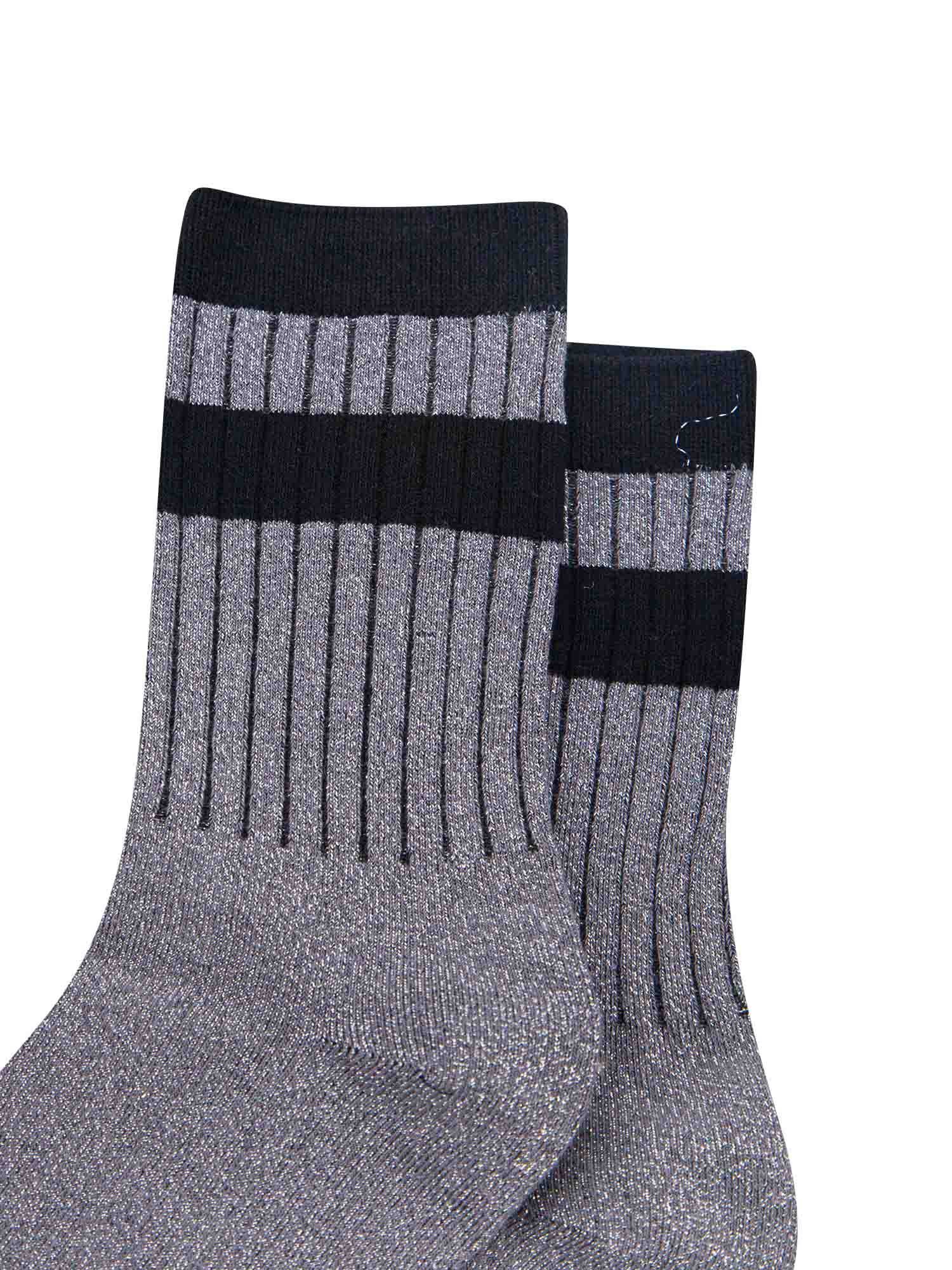 close up of the ribbed sports style cuffs on the socks. they have vertical ribbed details. the base of the socks are grey with a silver glitter sparkle. the cuff is black and there is a horizontal black band stripe, without glitter an inch below the cuff. 