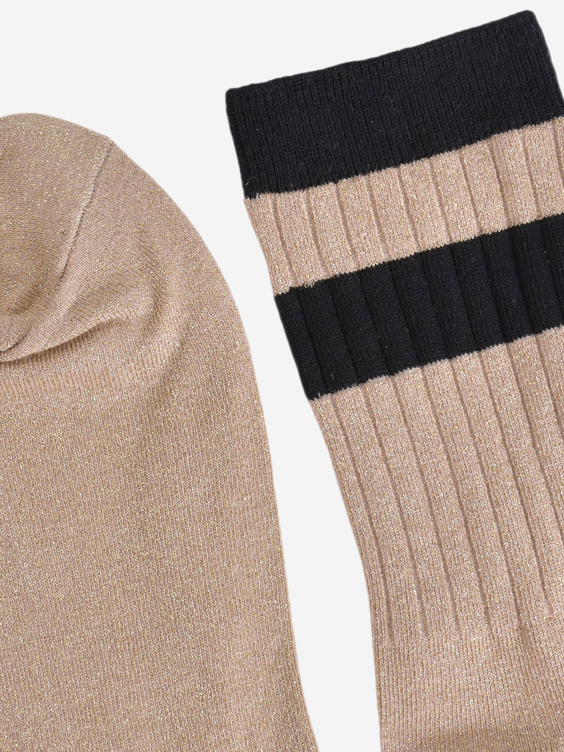 close up of the toe and cuff. the toe is gold and sparkly the same as the base of the socks. the cuff is black and without glitter.