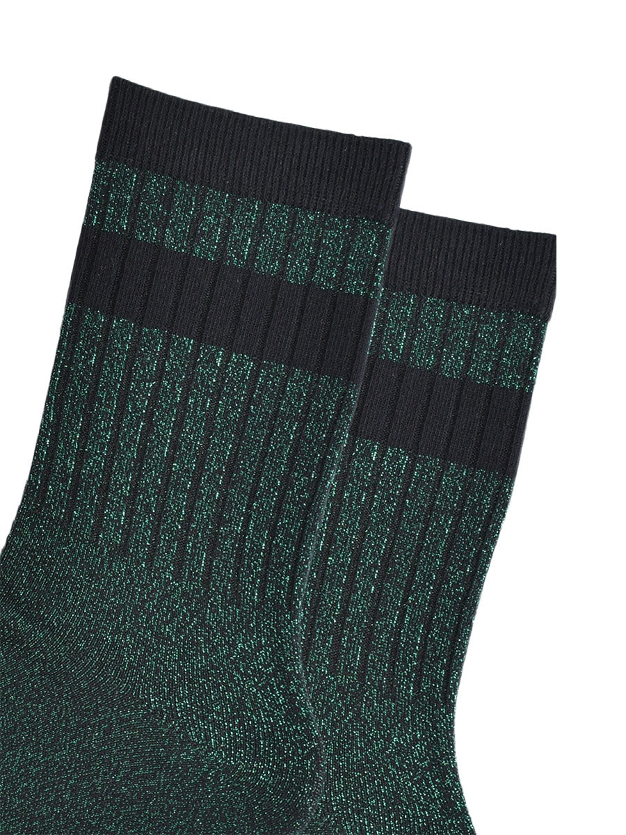 close up of the ribbed sports style cuffs on the socks. they have vertical ribbed details. the base of the socks are green with a silver glitter sparkle. the cuff is black and there is a horizontal black band stripe, without glitter an inch below the cuff. 