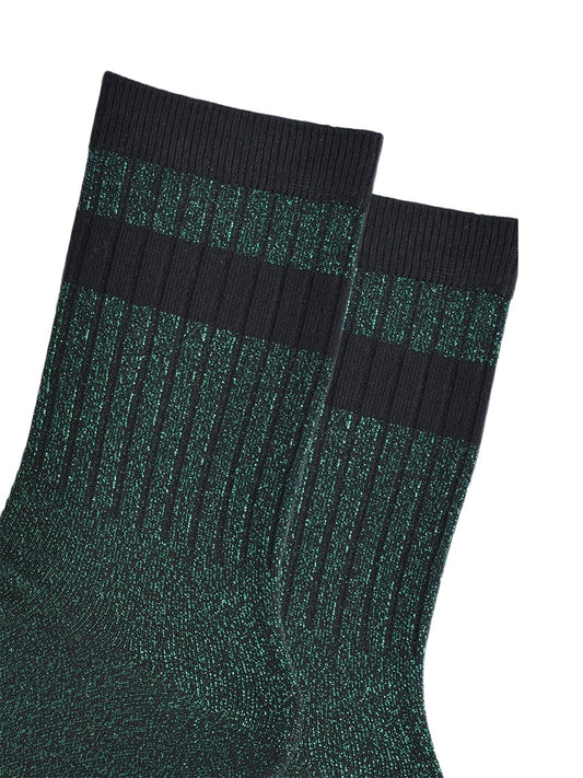 close up of the ribbed sports style cuffs on the socks. they have vertical ribbed details. the base of the socks are green with a silver glitter sparkle. the cuff is black and there is a horizontal black band stripe, without glitter an inch below the cuff. 