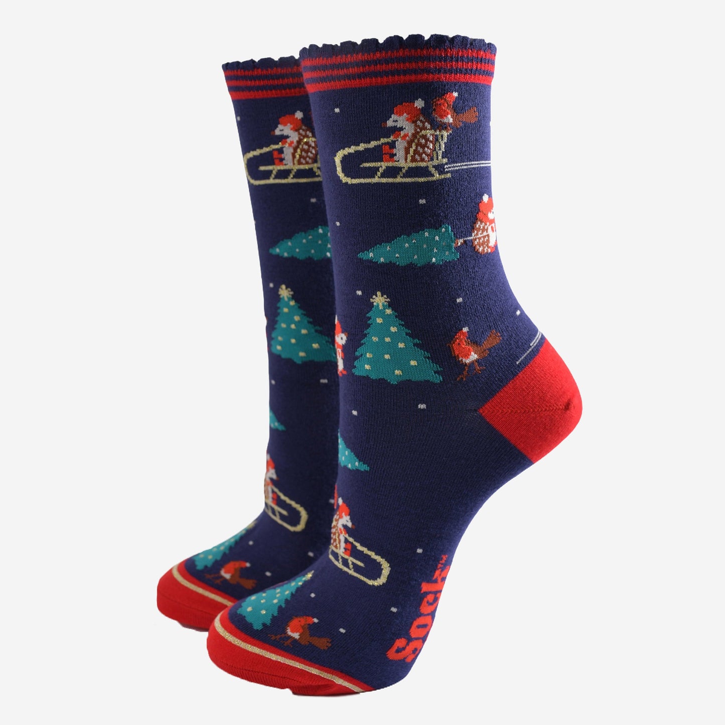 navy blue and red ankle socks featuring a sledging hedgehog, red robins and xmas trees