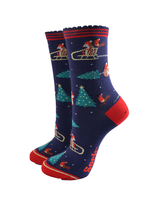 navy blue and red ankle socks featuring a sledging hedgehog, red robins and xmas trees