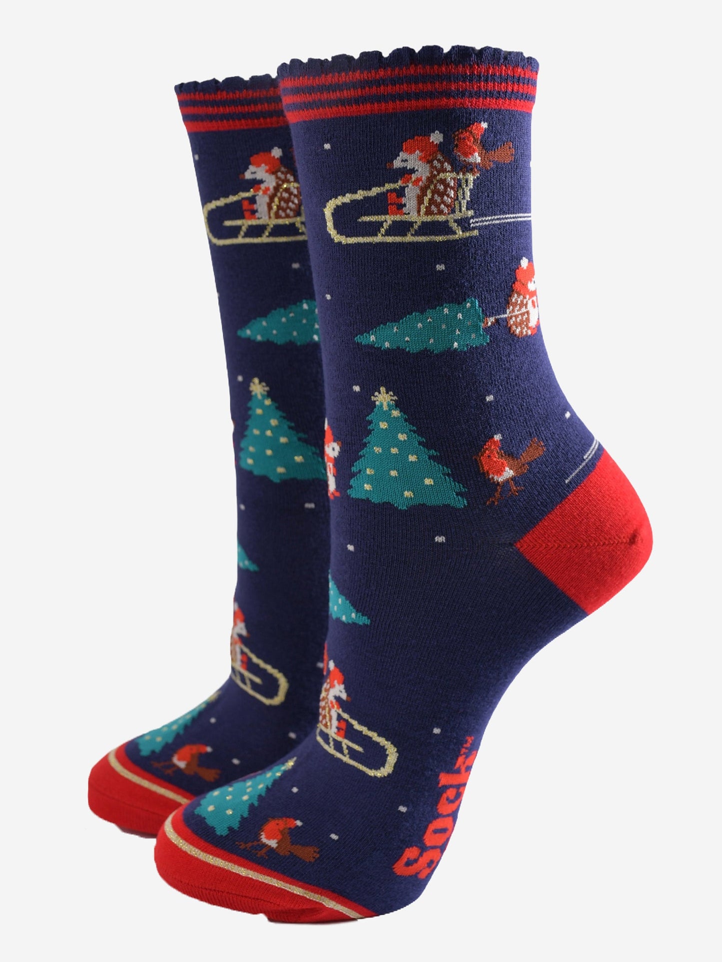 navy blue and red ankle socks featuring a sledging hedgehog, red robins and xmas trees