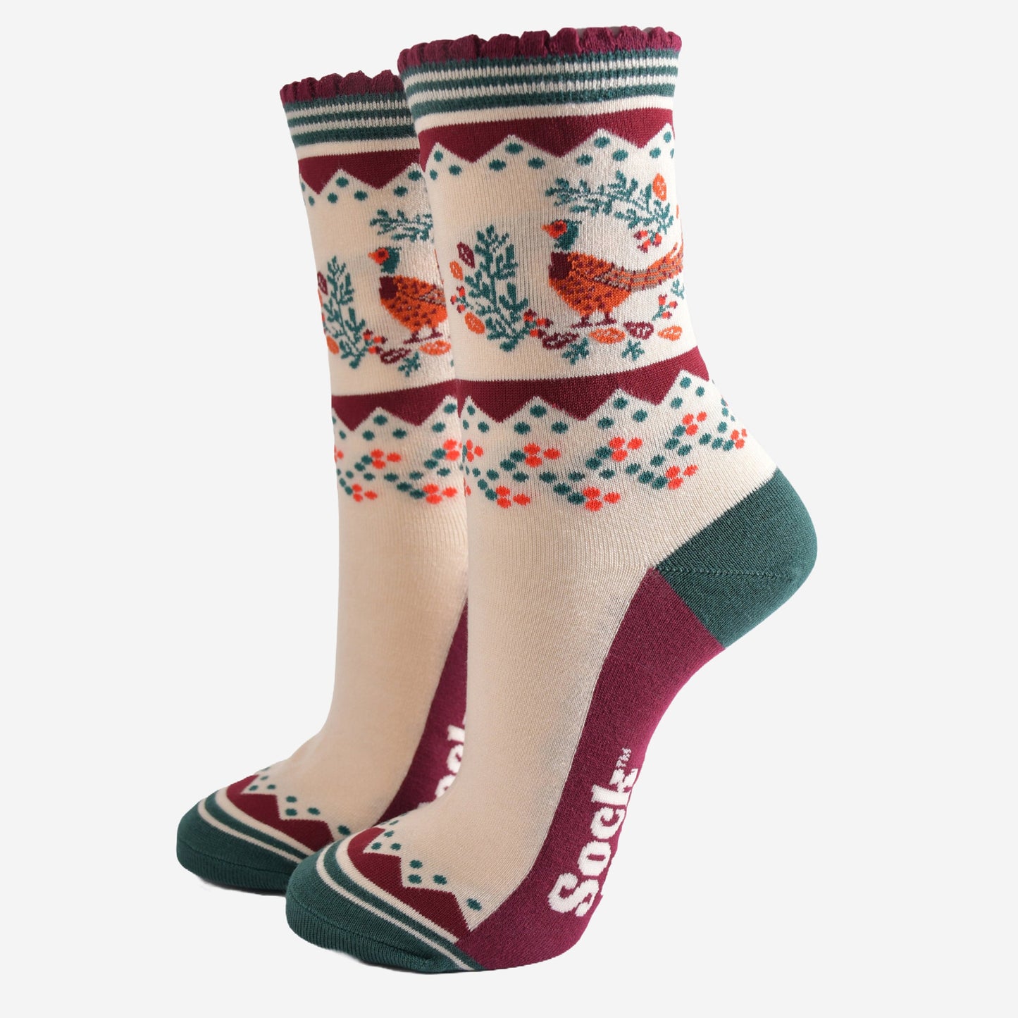 cream, green and burgundy socks with a woodland pheasant and autumn foliage wreath on the ankle