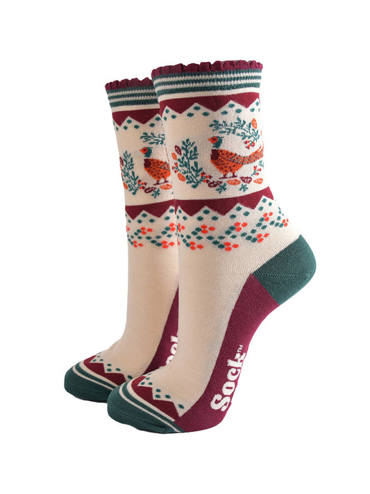 cream, green and burgundy socks with a woodland pheasant and autumn foliage wreath on the ankle
