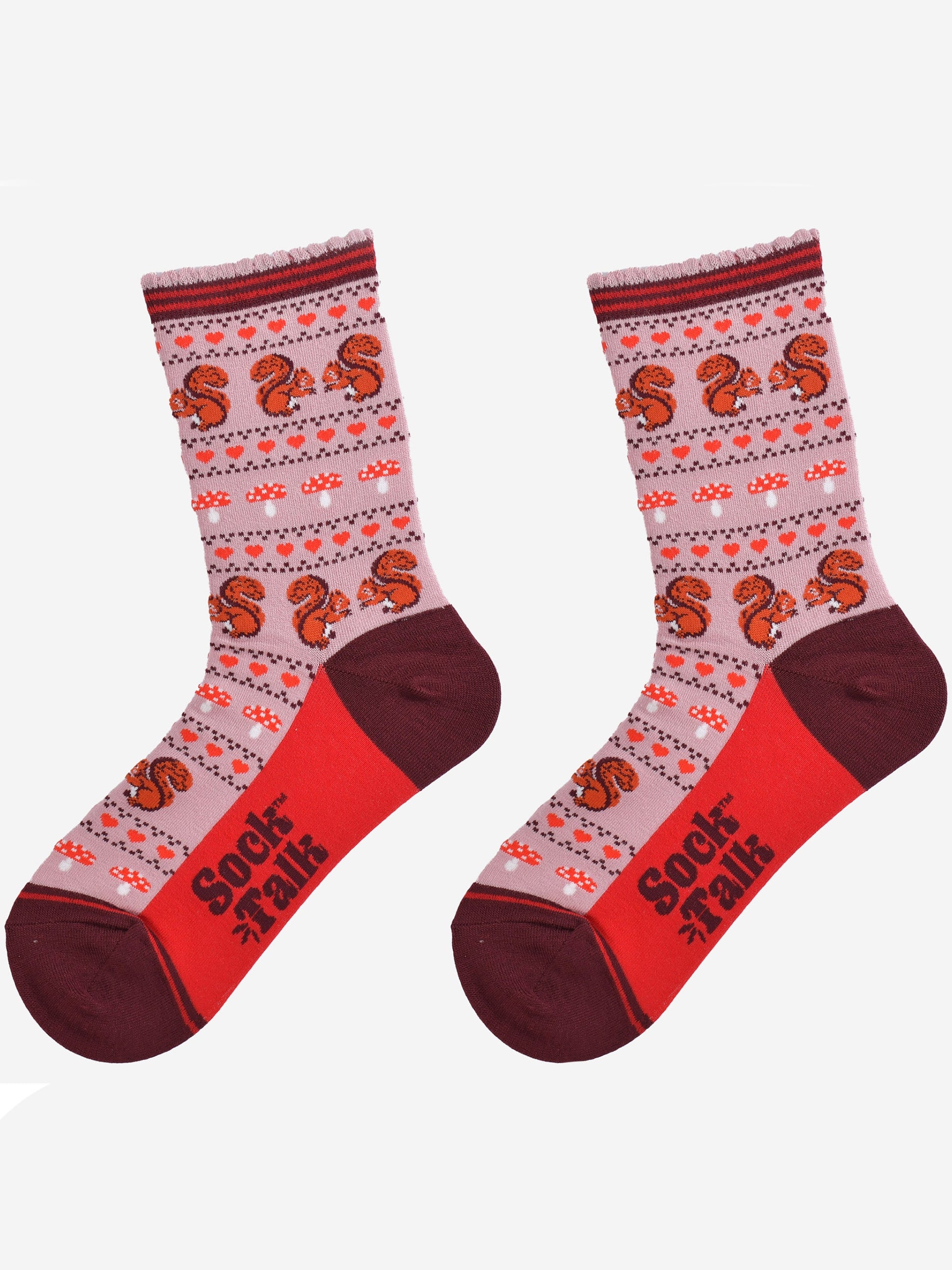 squirrel fair isle pattern socks laying flat, showing the all over pattern featuring red squirrels, toad stools and red love hearts