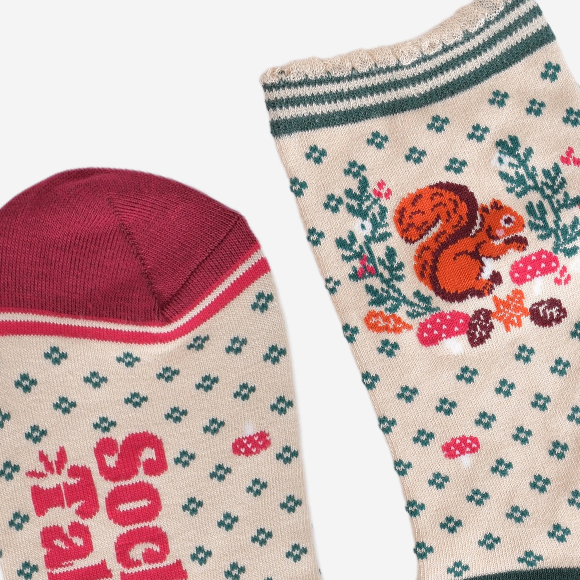 close up of the toe and cuff, the toe is burgundy in contrast to the cream colourway of the socks, the cuff is scalloped and has a green striped trim