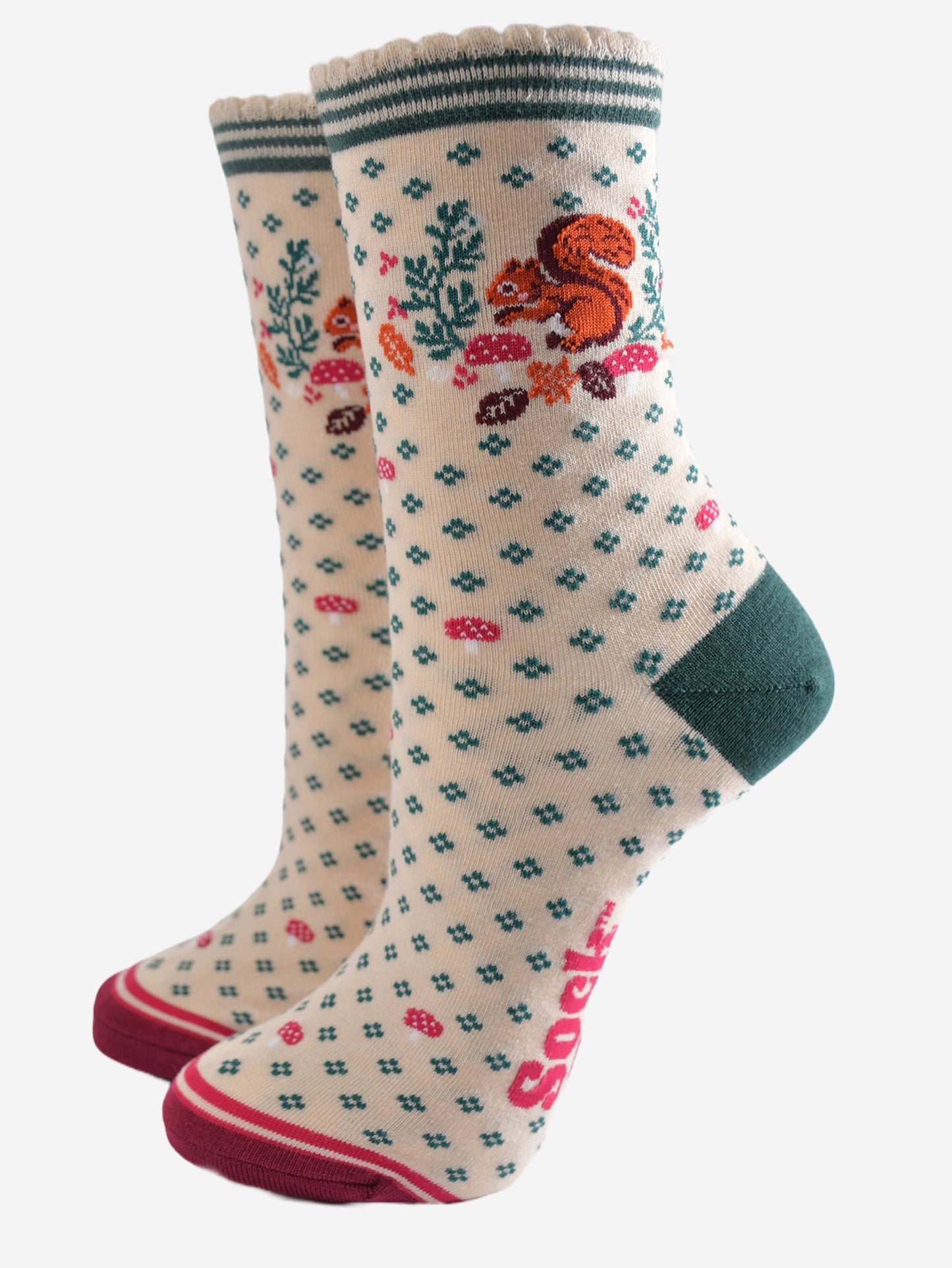 cream socks with a red squirrel, toadstools and autumn leaves on the ankle