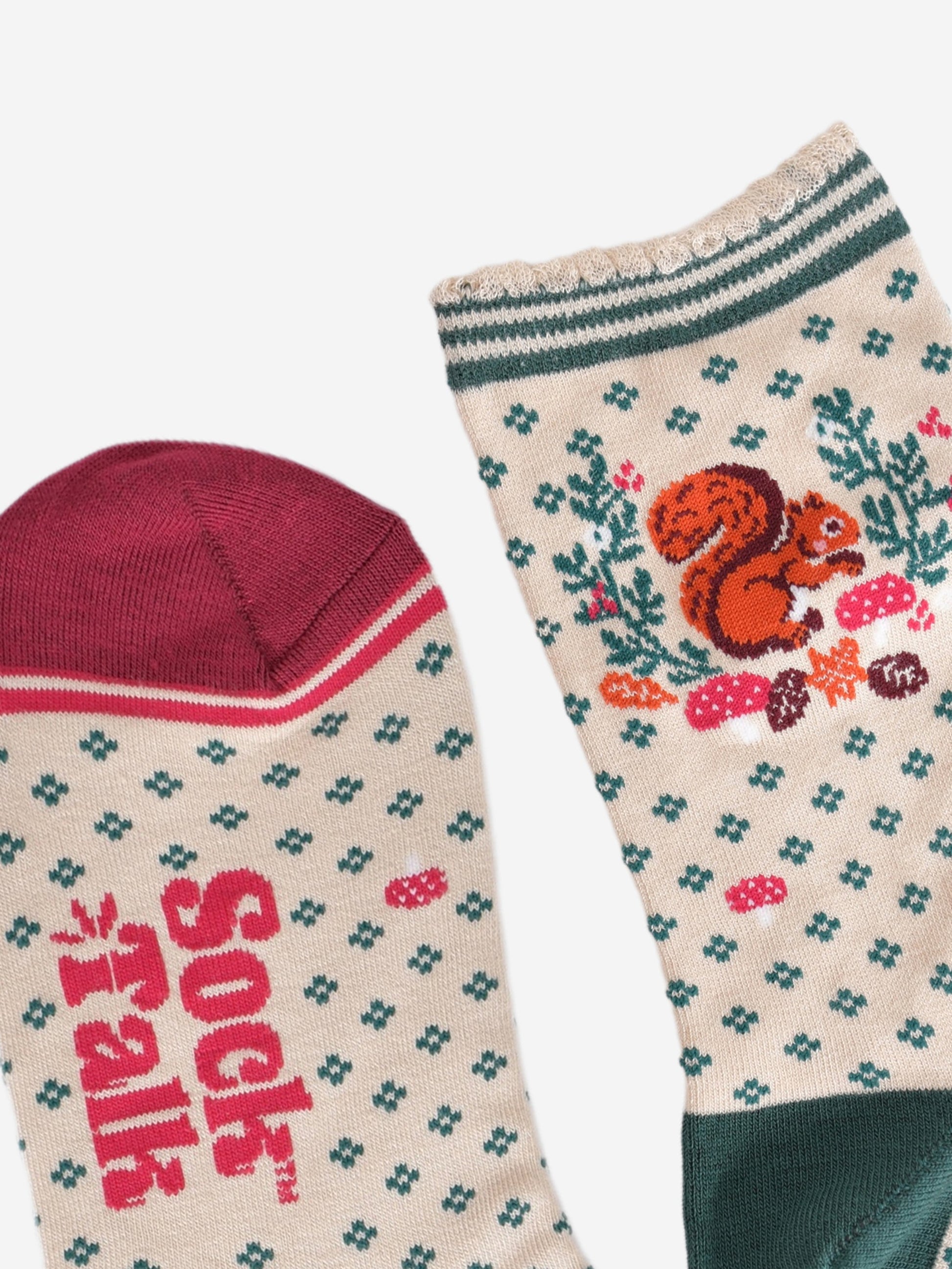 close up of the toe and cuff, the toe is burgundy in contrast to the cream colourway of the socks, the cuff is scalloped and has a green striped trim