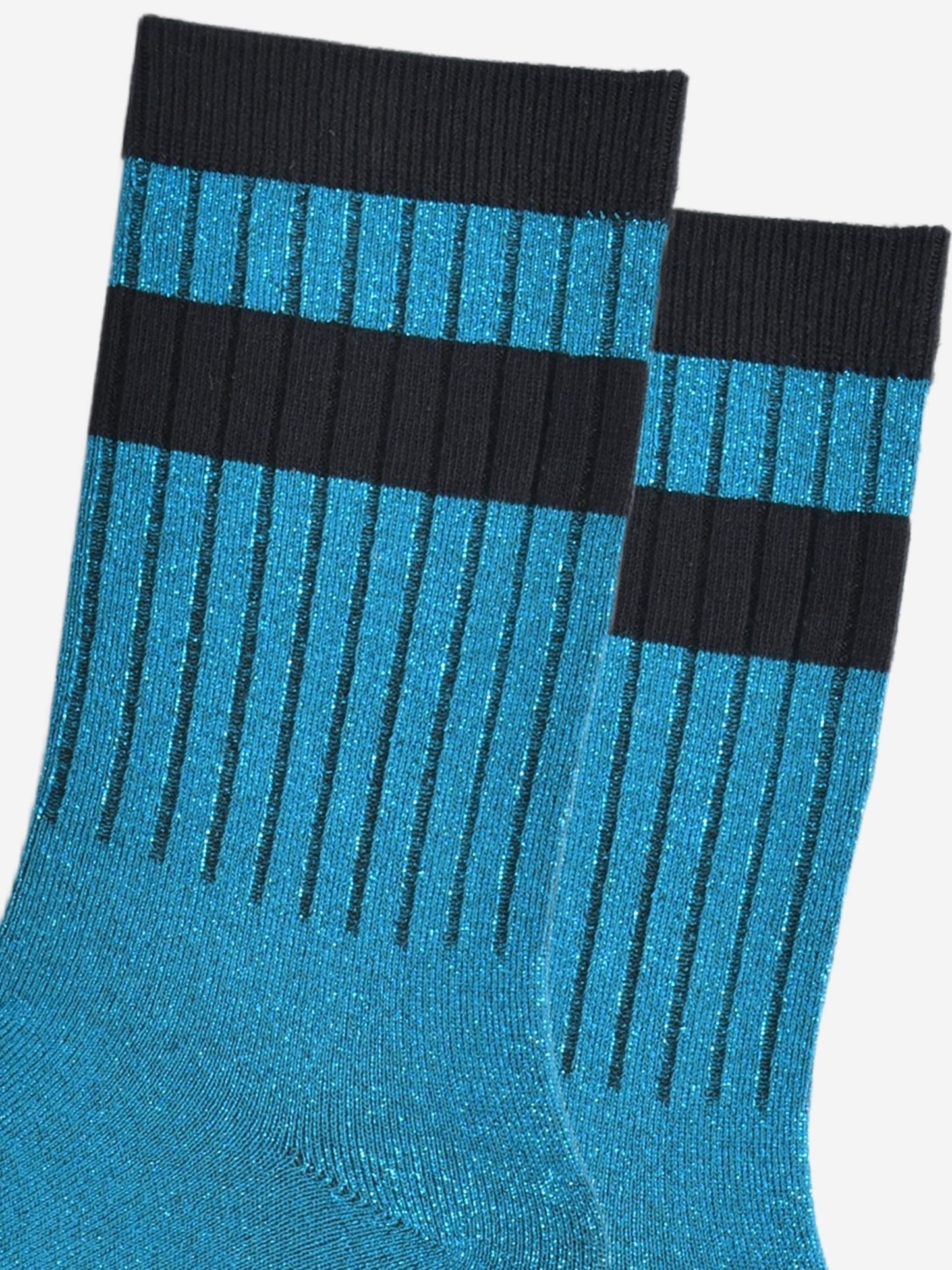 close up of the ribbed sports style cuffs on the socks. they have vertical ribbed details. the base of the socks are teal blue with a silver glitter sparkle. the cuff is black and there is a horizontal black band stripe, without glitter an inch below the cuff. 