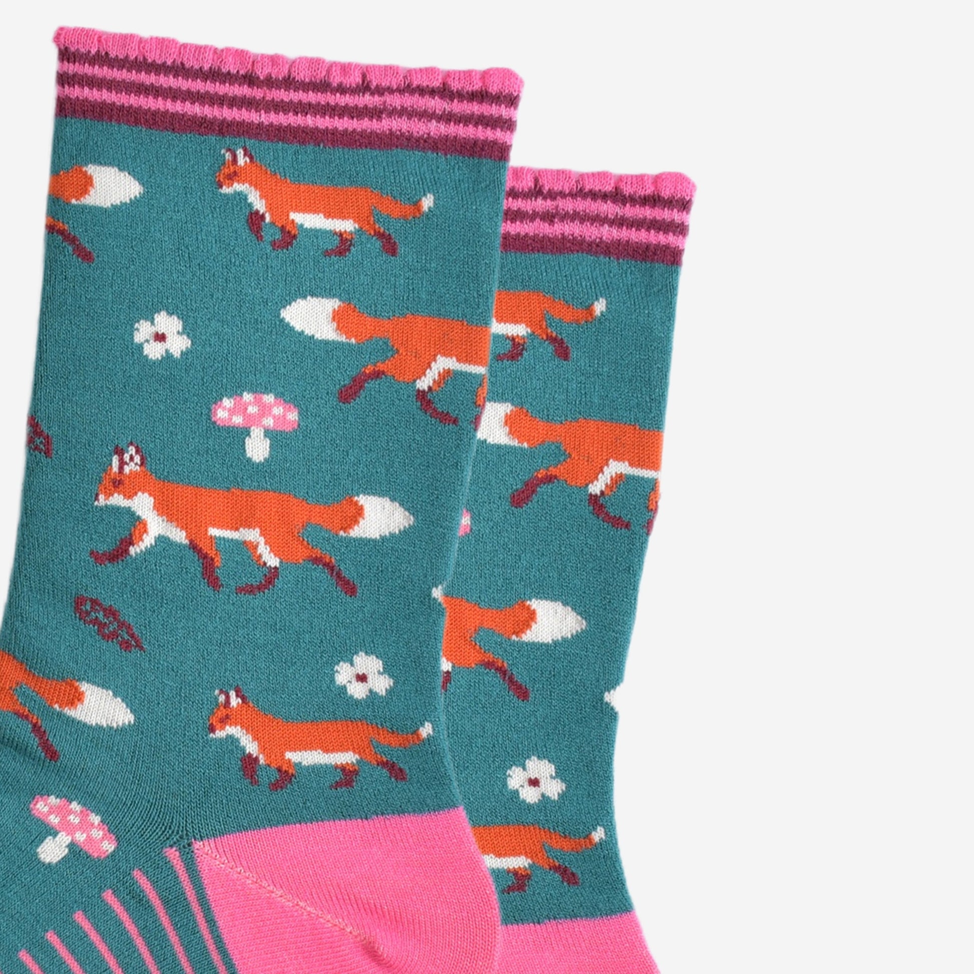 close up of the fox, toadstool and floral pattern on the socks