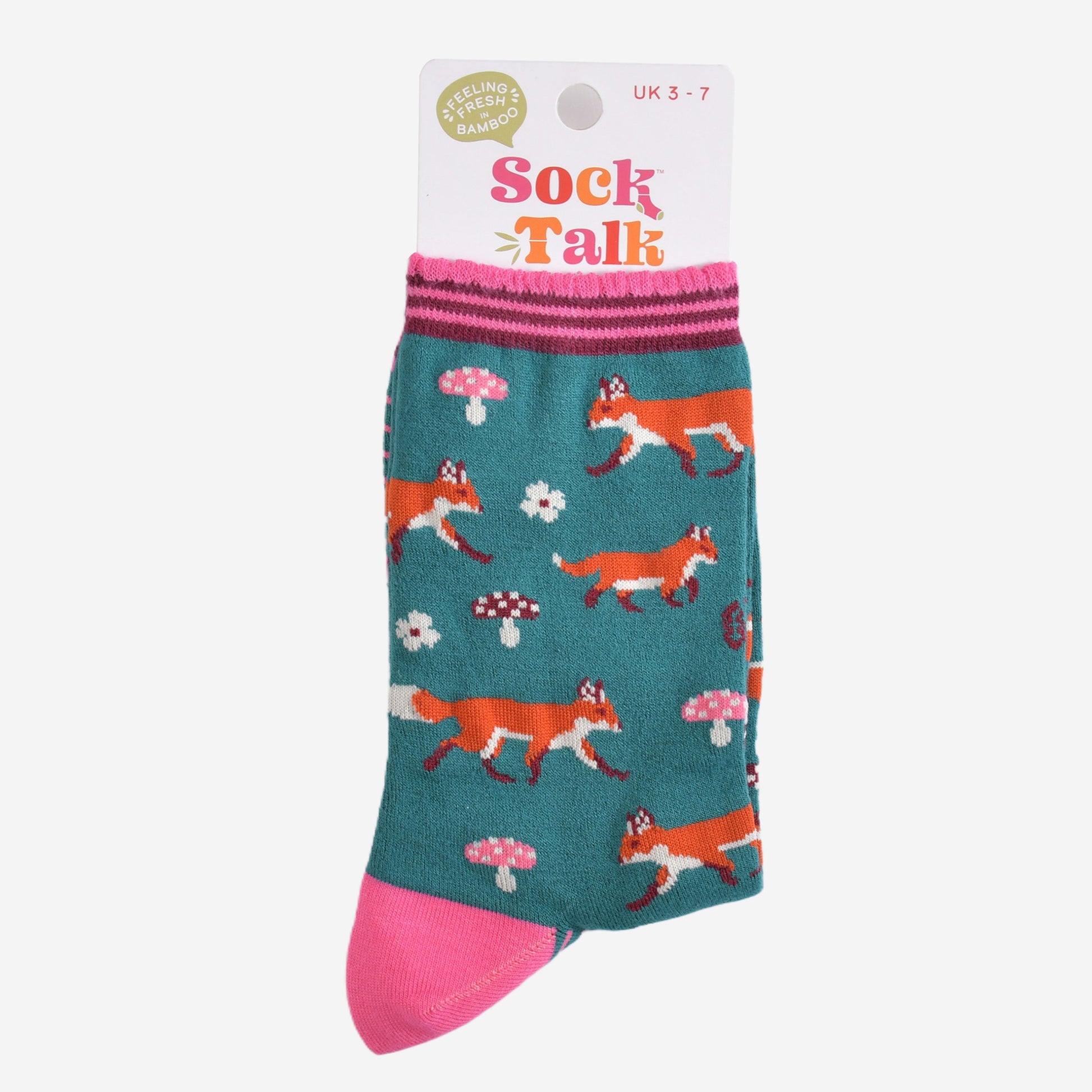 green and pink woodland fox bamboo socks in their sock talk packaging, the socks are a uk size 3-7