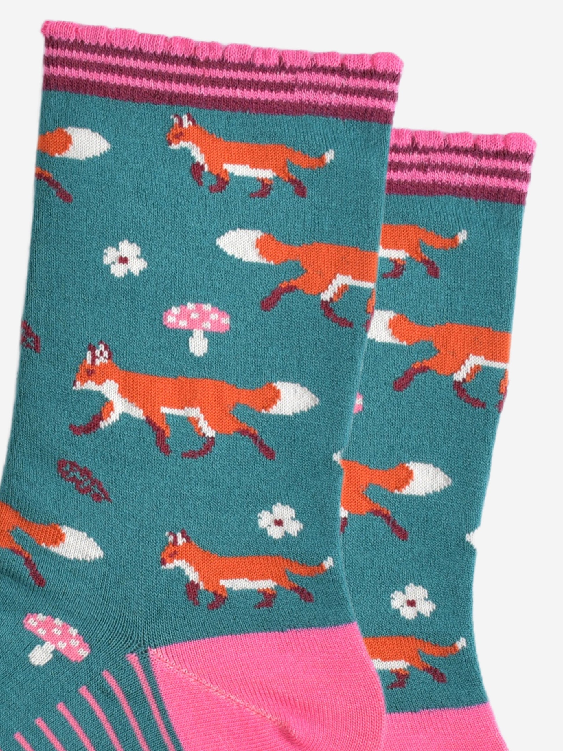 close up of the fox, toadstool and floral pattern on the socks
