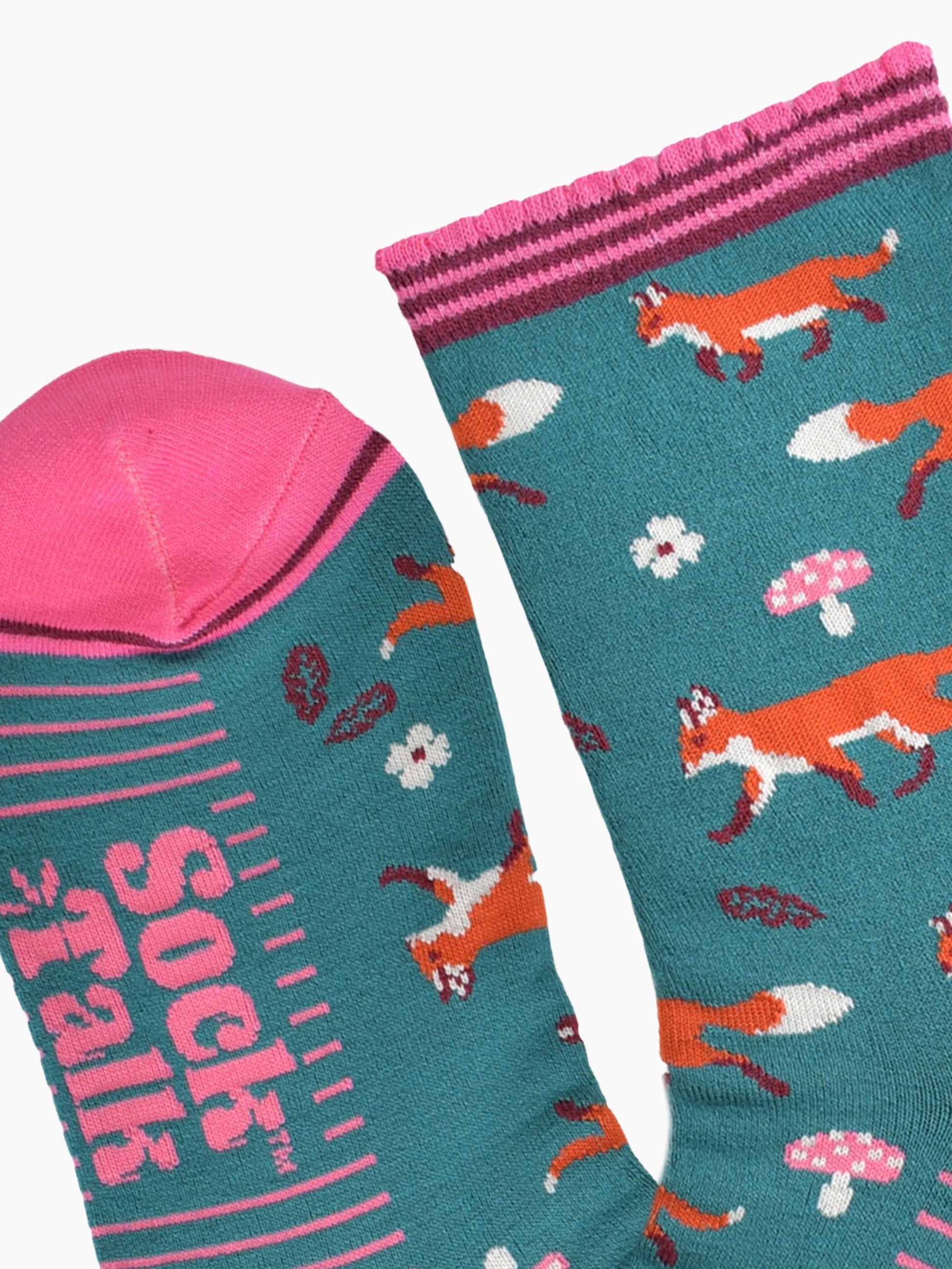 close up of the toe and cuff, the toe is pink with a thin burgundy stripe, the cuff is scalloped and also pink and burgundy striped, the sole of the socks have pink stripes on them